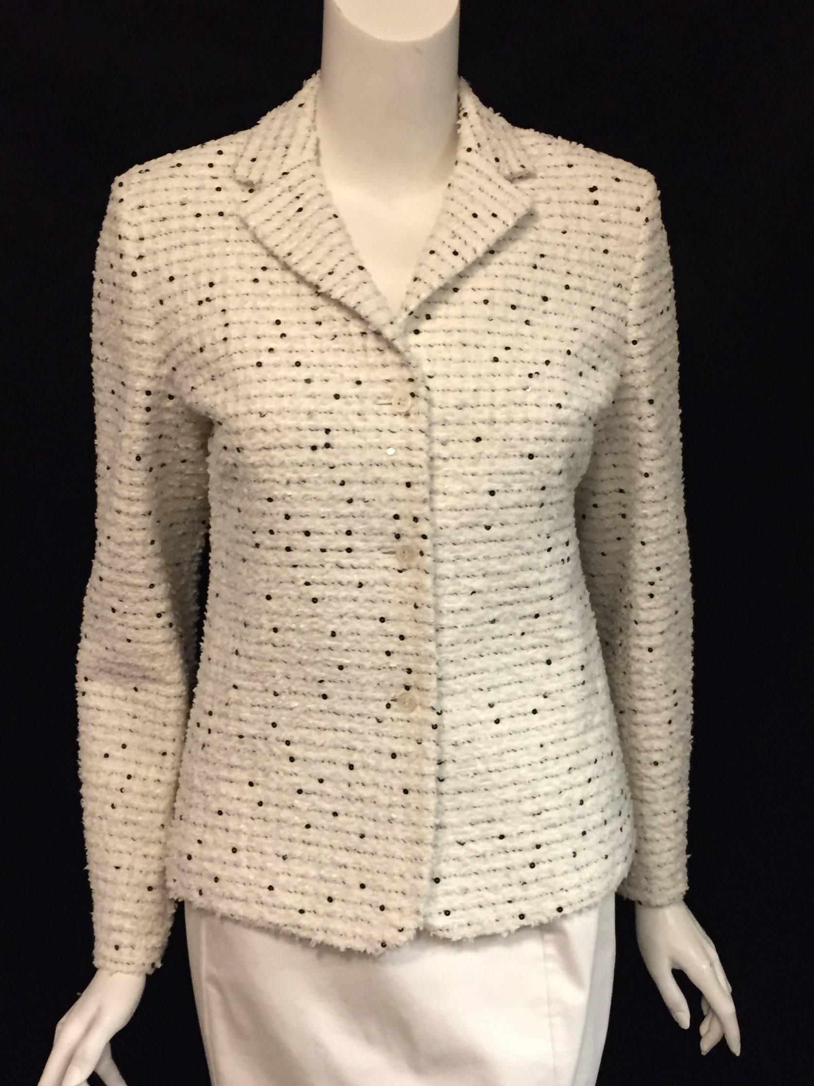 Brand new Bernard Zins tweed/boucle jacket in salt & pepper style is beautifully textured in white and black tweed with black sequins throughout.  Finished with notched collar and three button closure.  This garment is fully lined, including