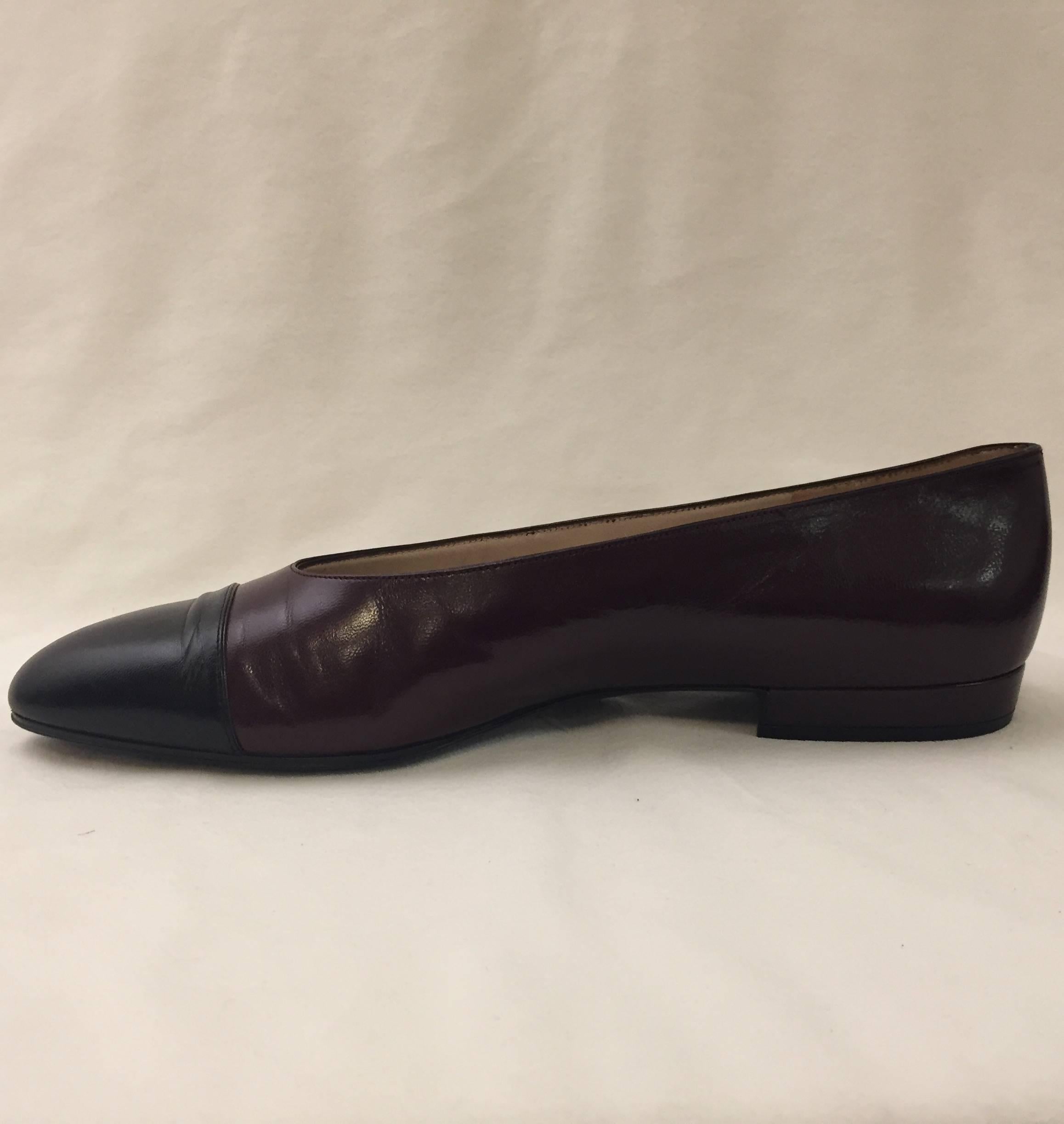 The passage of time has not made these shoes any less desirable!  Another generation of women have fallen in love with these chic flats in deep burgundy leather with signature black leather caps.  Finished with tan leather soles, insoles and lining.