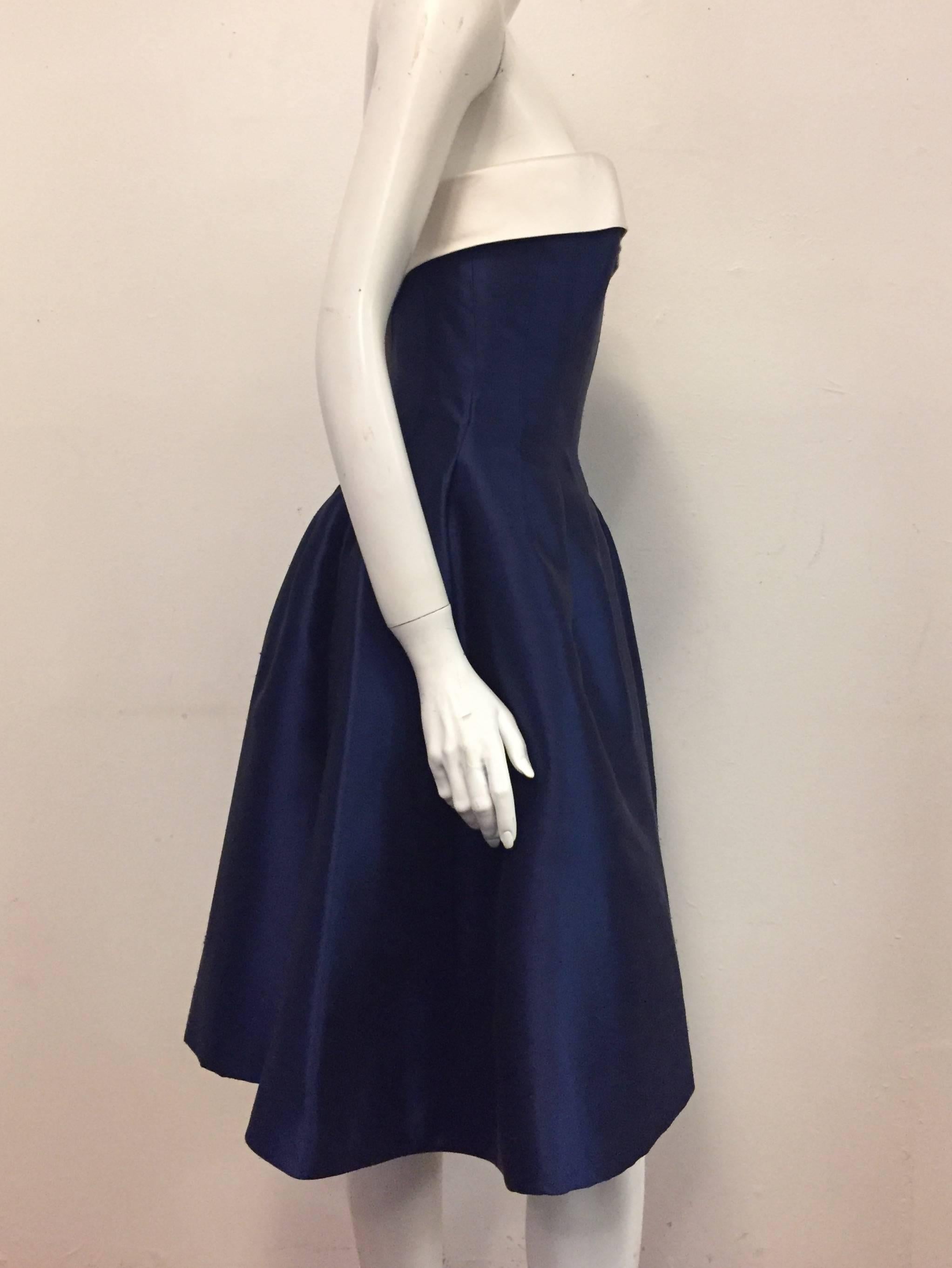 Anouska Hempel magnificent Royal Blue & White strapless cocktail dress with structured bodice at interior features pleated waist and full skirt.  The 3' raw white silk surrounds upper bodice of this superb dress perfectly contrasting the deep royal