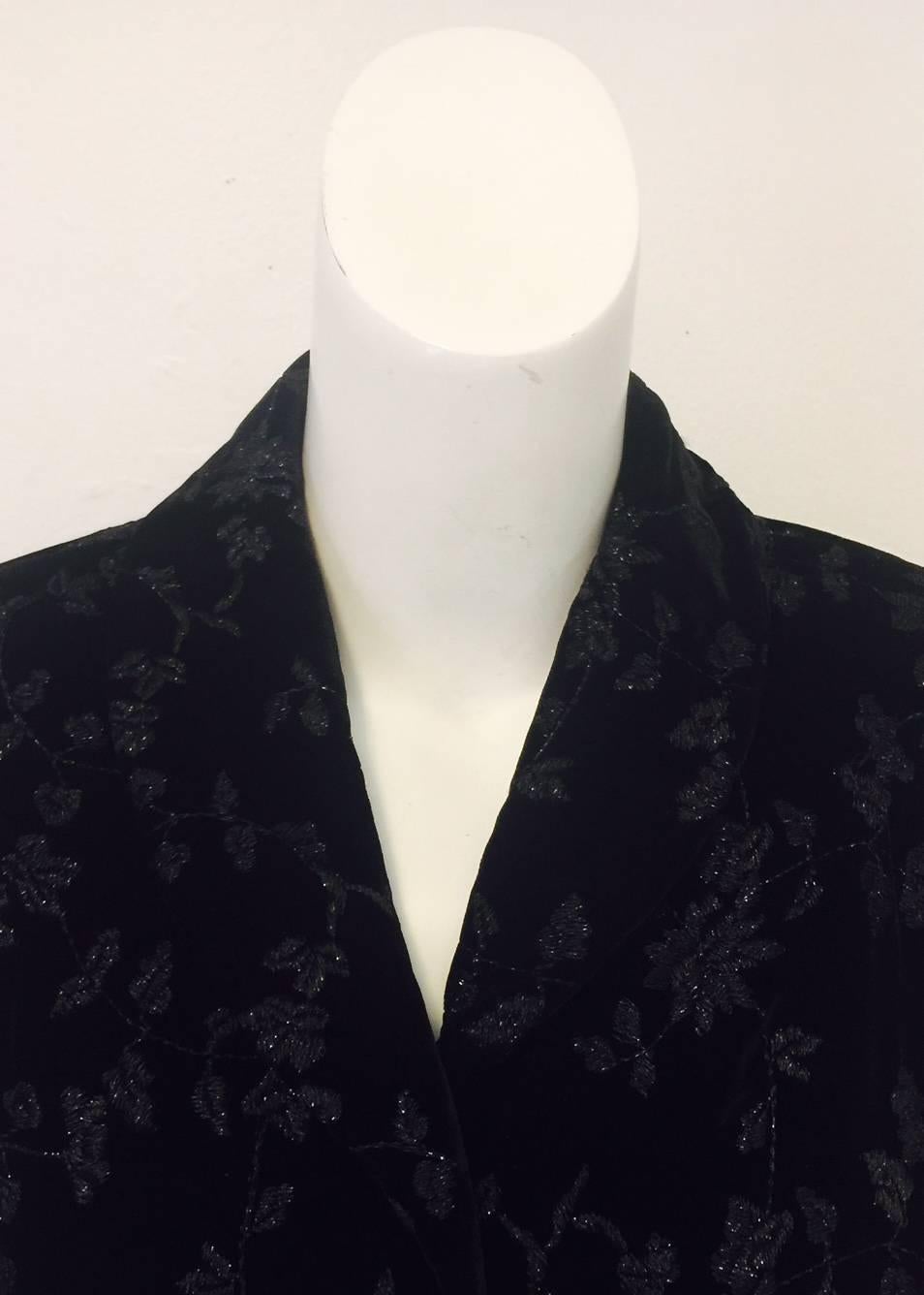 Oscar's renowned originality shines through in this black velvet jacket with black floral embroidery allover.  Putting on the 