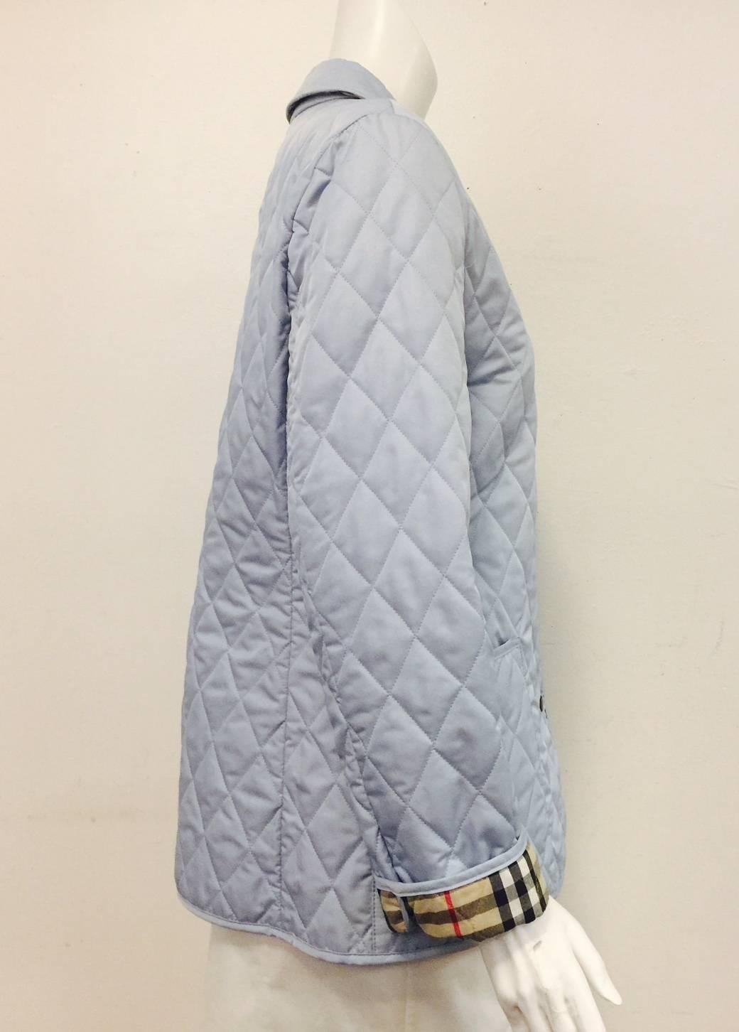Burberry London Diamond Quilt Nova Sky Blue Jacket Pointed collar that can be turned up for added wind & rain protection.  Smartly placed dual patch pockets at hips for essentials.  Weathered brass -tone snap closures at front. The sleeves may be