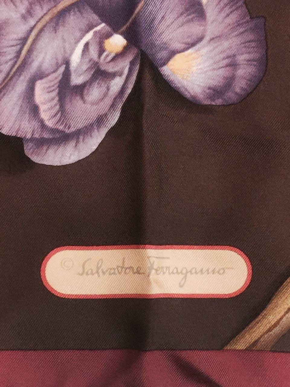 Salvatore Ferragamo Chocolate Silk Scarf is a must for any woman of substance!  Features ultra-luxurious fabric,  burgundy border, and an exotic display of calla lilies and various iris shades.  Truly elegant finish to any ensemble.  Excellent