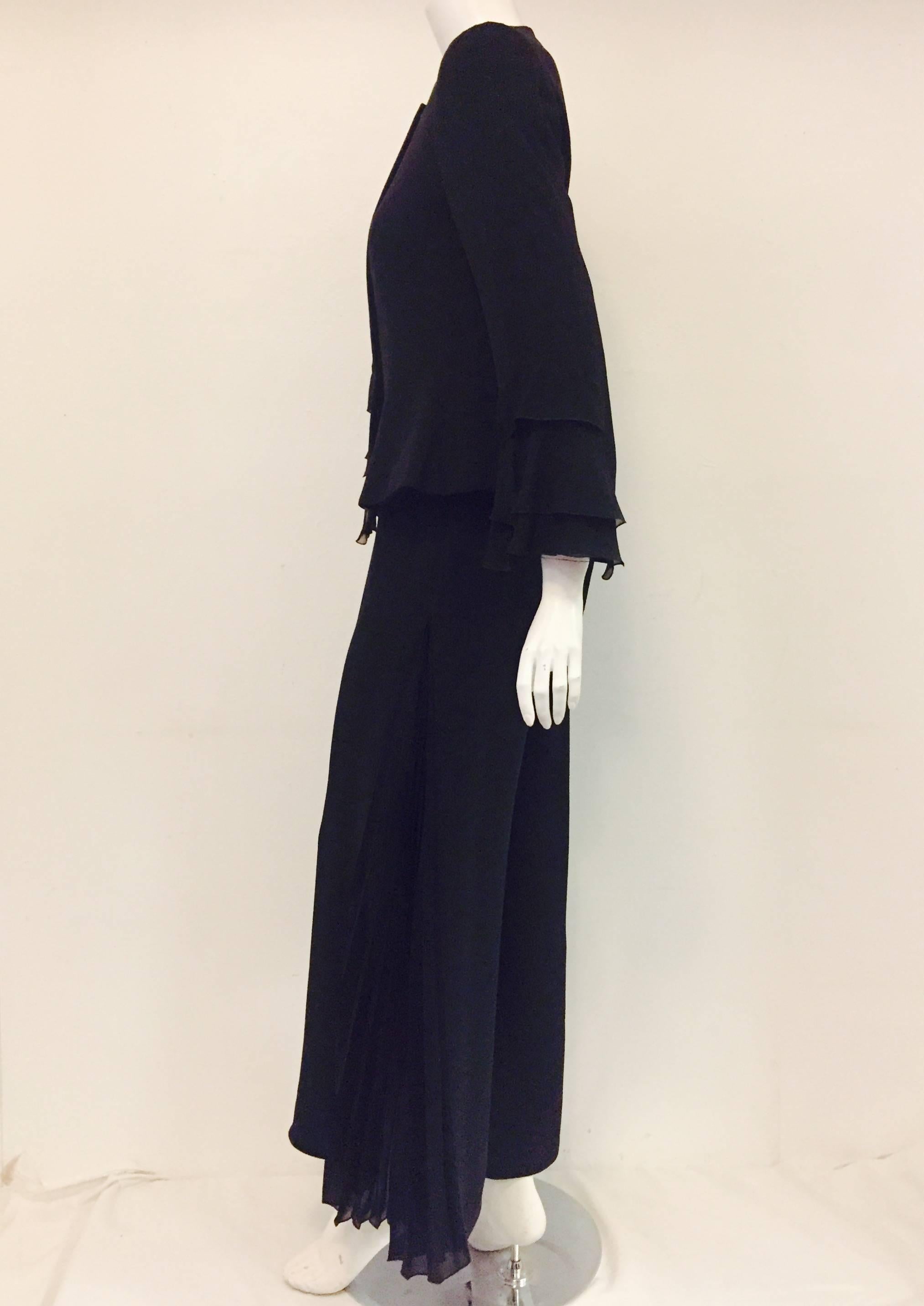 Glorious Giorgio Armani evening silk pantsuit with long sleeve jacket top and stylish palazzo pleated pants.  The jacket top has beautifully decorated sleeves with faux pleats and ruffles at the cuff enhancing its luxury impression.  The front also