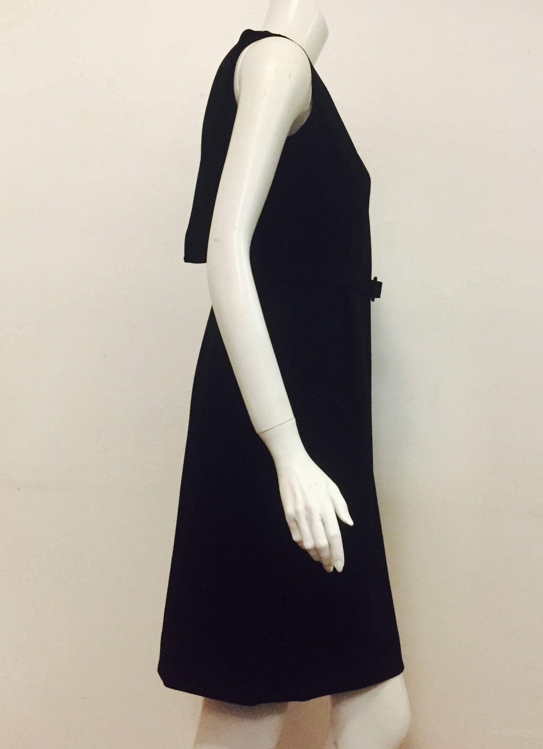 Oscar de la Renta designed for all women, from movie stars to top executives, to socialites.  This Oscar de la Renta sleeveless black wool dress with tonal stitching that accentuates the bust line and the waist is classic and timeless.  Personalize