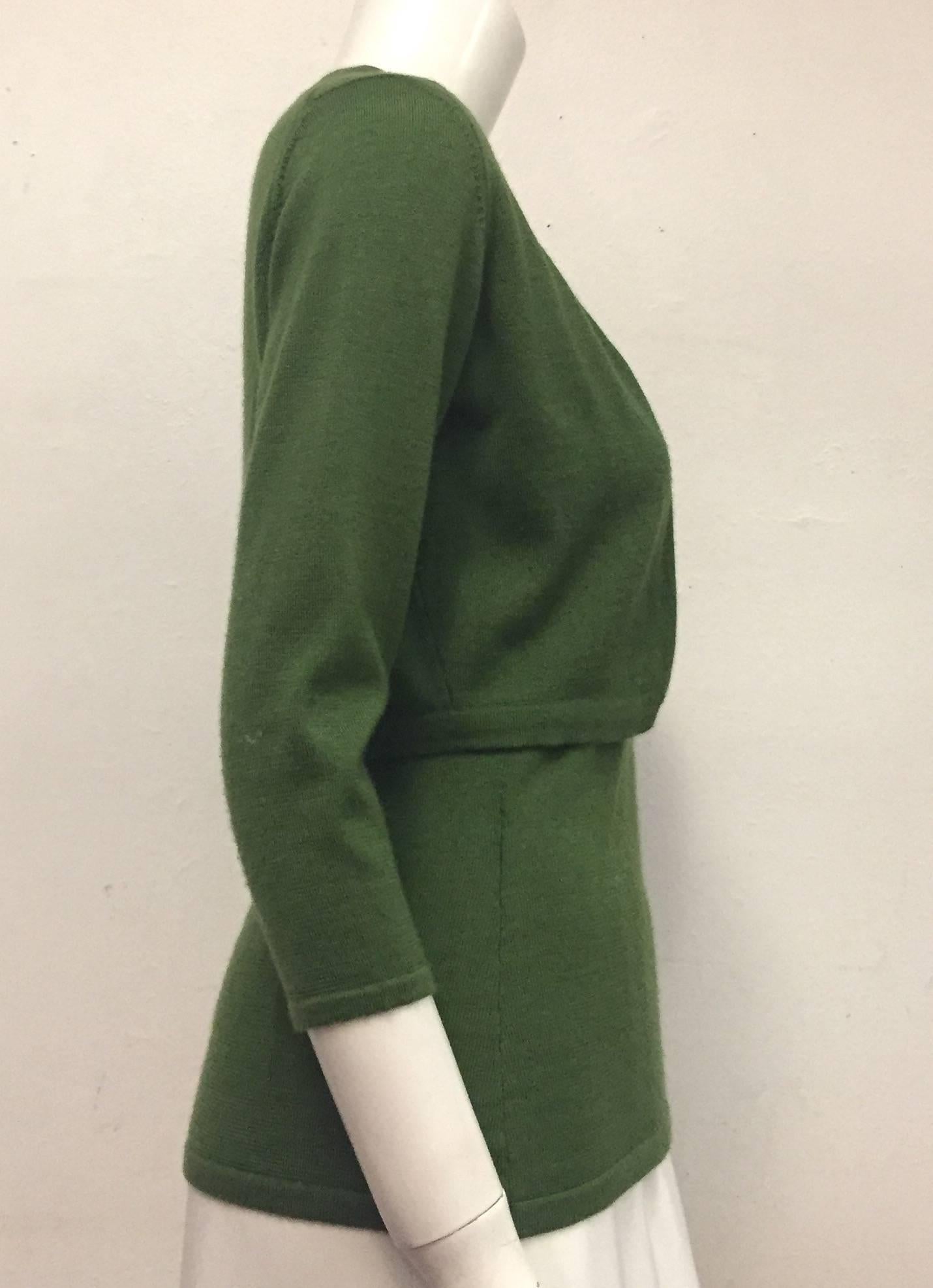 Oscar de la Renta's autumn green cashmere and silk, knit twin set is wonderful for fall and winter.  This set is ribbed on neck lines, sleeve openings, hems and cuffs.  The vest is sleeveless.  Bolero has 3/4 sleeves and 4 way stretch fabrication