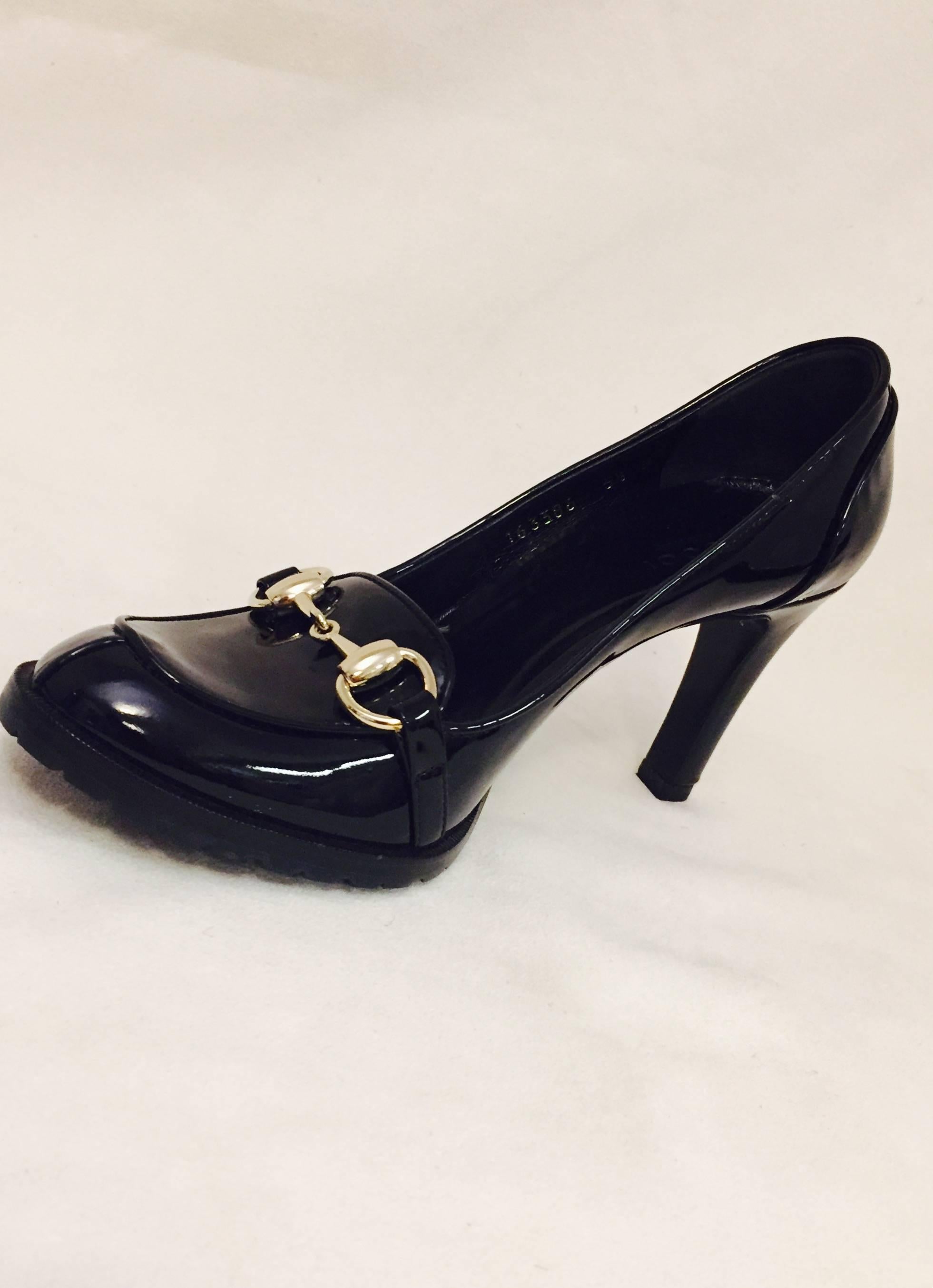 Gucci black patent leather round toe pumps with tonal stitching.  This pair is in excellent condition down to its rubber soles, that are great to prevent slipping on icy sidewalks.   They have covered 3 1/2
