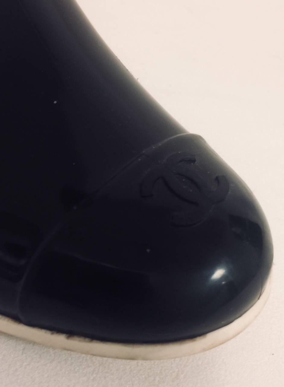 Coveted Chanel Black Cap Toe Wellington Boots with Two Camellia Shaft In Good Condition In Palm Beach, FL