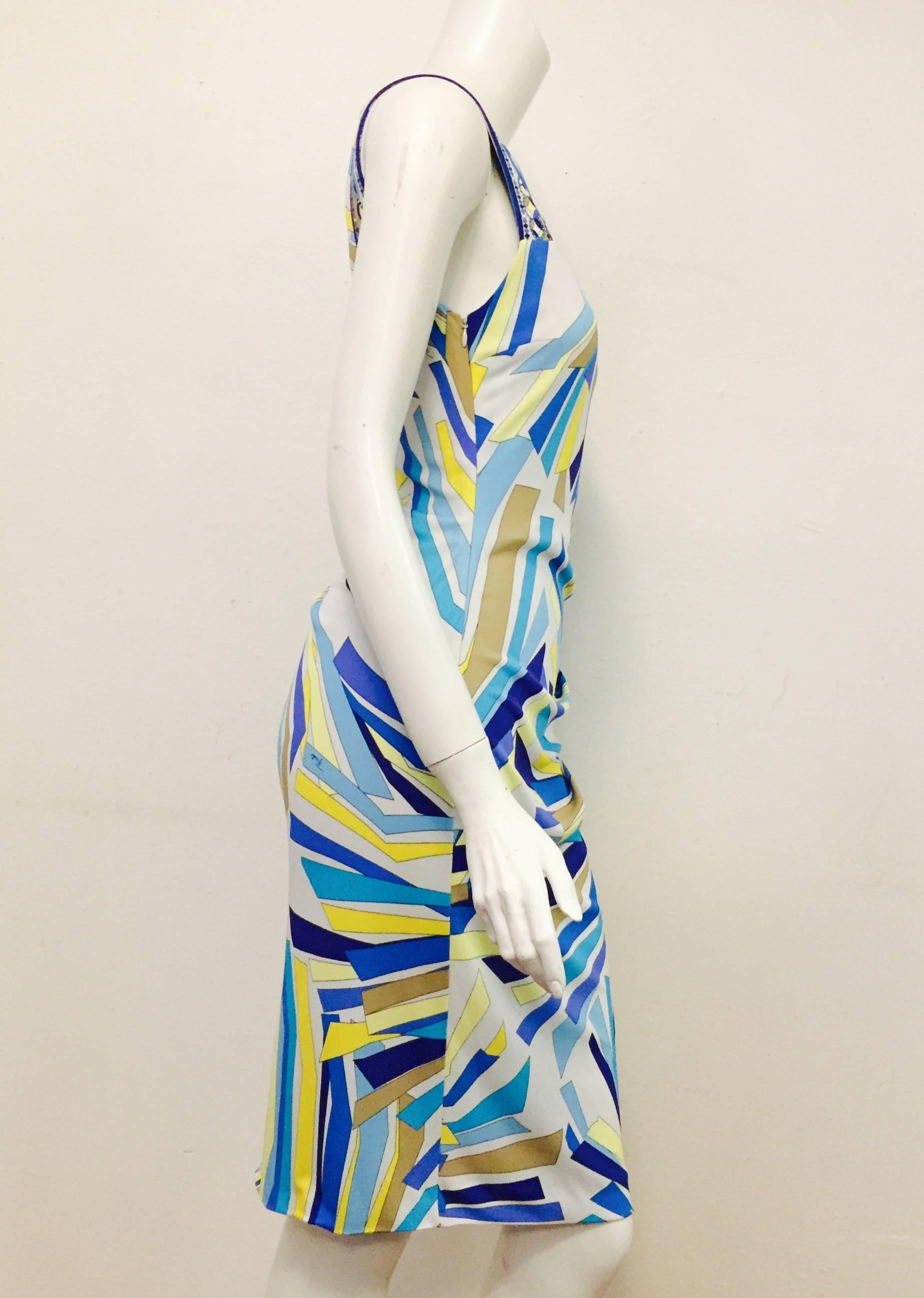 Sleeveless Exotic Print Sheath Dress is quintessentially Emilio Pucci!  Abstract seafoam, turquoise, aubergine, and sunburst yellow print highlights a form-fitting, flattering design. Dress is draped and gathered on left hip and features a