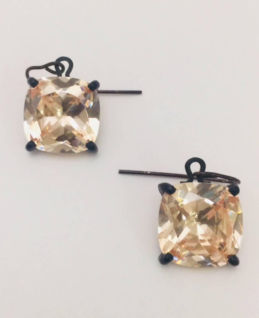 Bottega Veneta is more than handbags!  This stunning set begins with black rhodium sterling silver.  French back pierced earrings boast square faceted rose champagne cubic zirconias set in prongs.  Earrings measure 1/2
