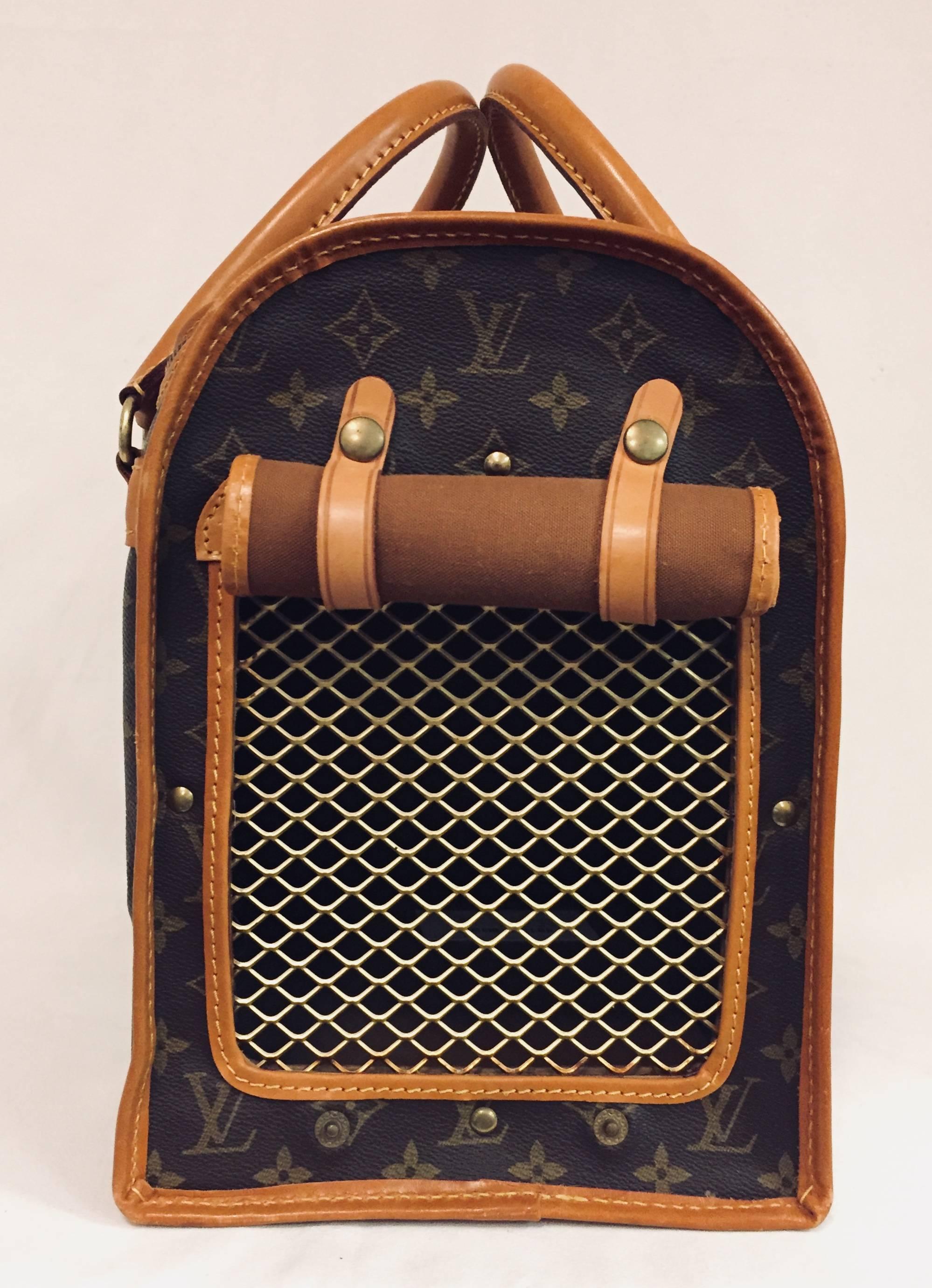 Even beloved pets prefer traveling with their "Louis" luggage! Pamper pooches or couture cats in this quintessential carrier from the inimitable Louis Vuitton collection. Features Vuitton's signature monogram canvas, Vachetta leather trim,