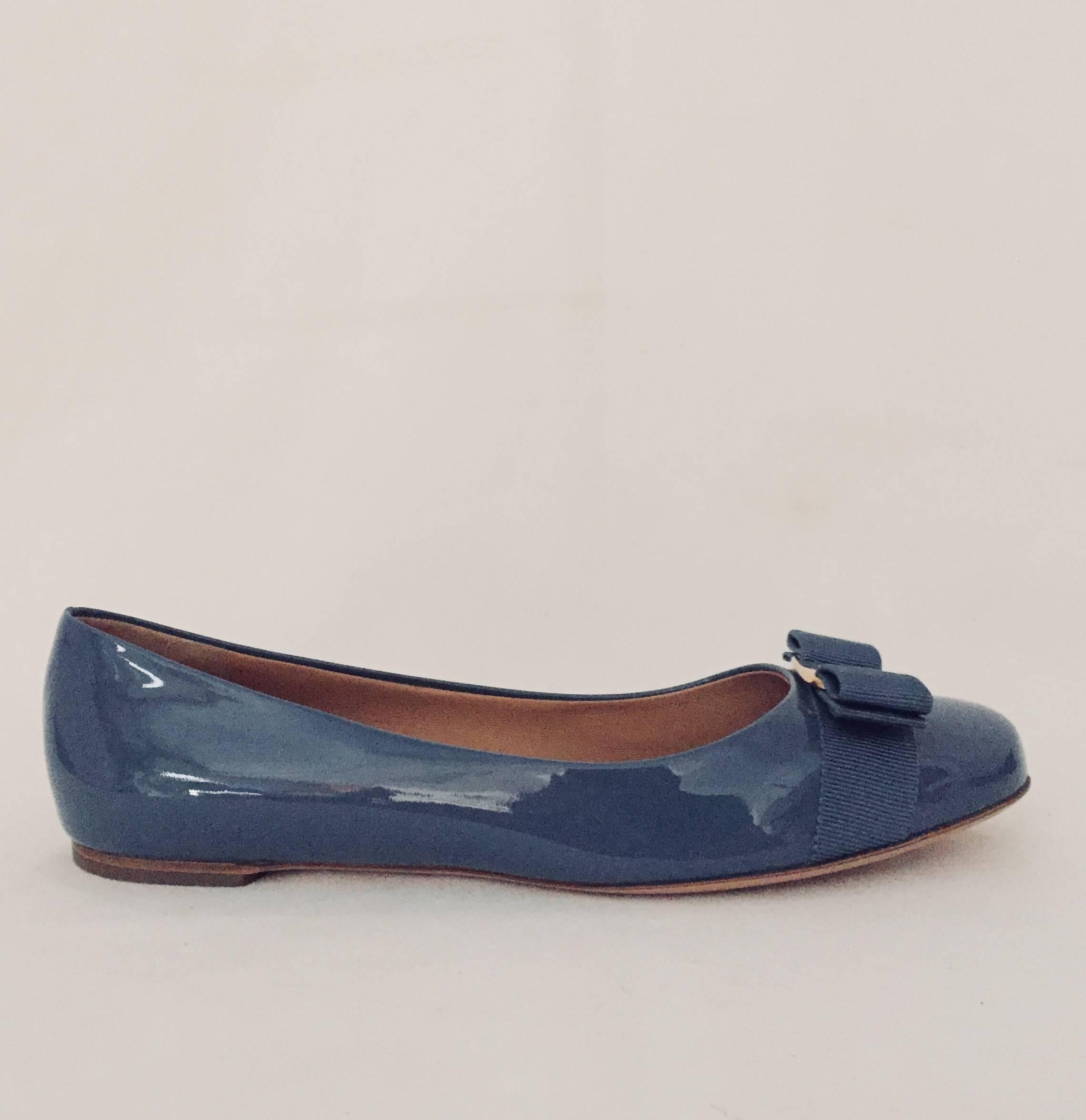 Salvatore Ferragamo's classic Varina ballet flat has become a fashion staple for legions of fashionable women!  This pair features ultra-luxurious patent calf leather in an alluring shade of 