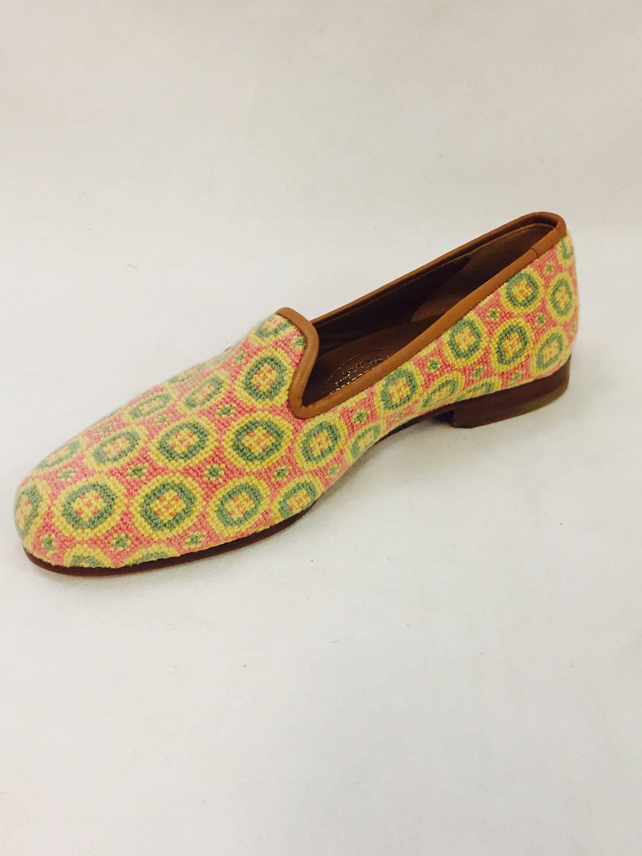 Stubbs & Wootton Slippers in outstanding needlepoint fabric comprised of multi colored circles of yellow, green and pink across the exterior of the shoes.  These shoes are fully lined in beige leather on the sole and insole.  The shoes have a