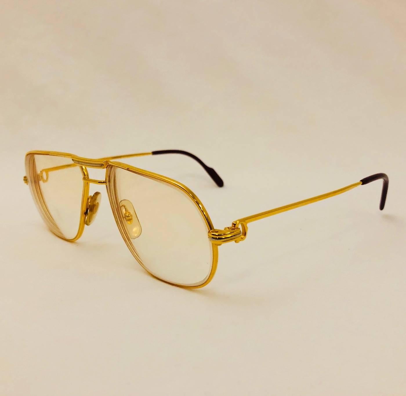 Vintage Cartier Vendome Glasses are highly desired by all connoisseurs of fine eyewear in general and Cartier in particular!     Features gold larger frame, signature temple adornment, and iconic logo temple tips.  Clear Prescription Lenses can be