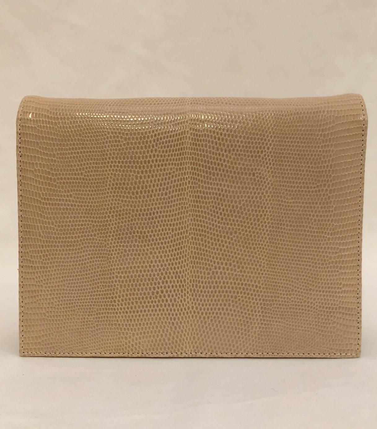 Lana Marks lizard skin bag is sure to please the most discerning collector! Luxurious, ultra-versatile beige bag includes one strap crafted from the same tan lizard. Of course, shoulder bag converts to a remarkable clutch!  Magnetic snap closure