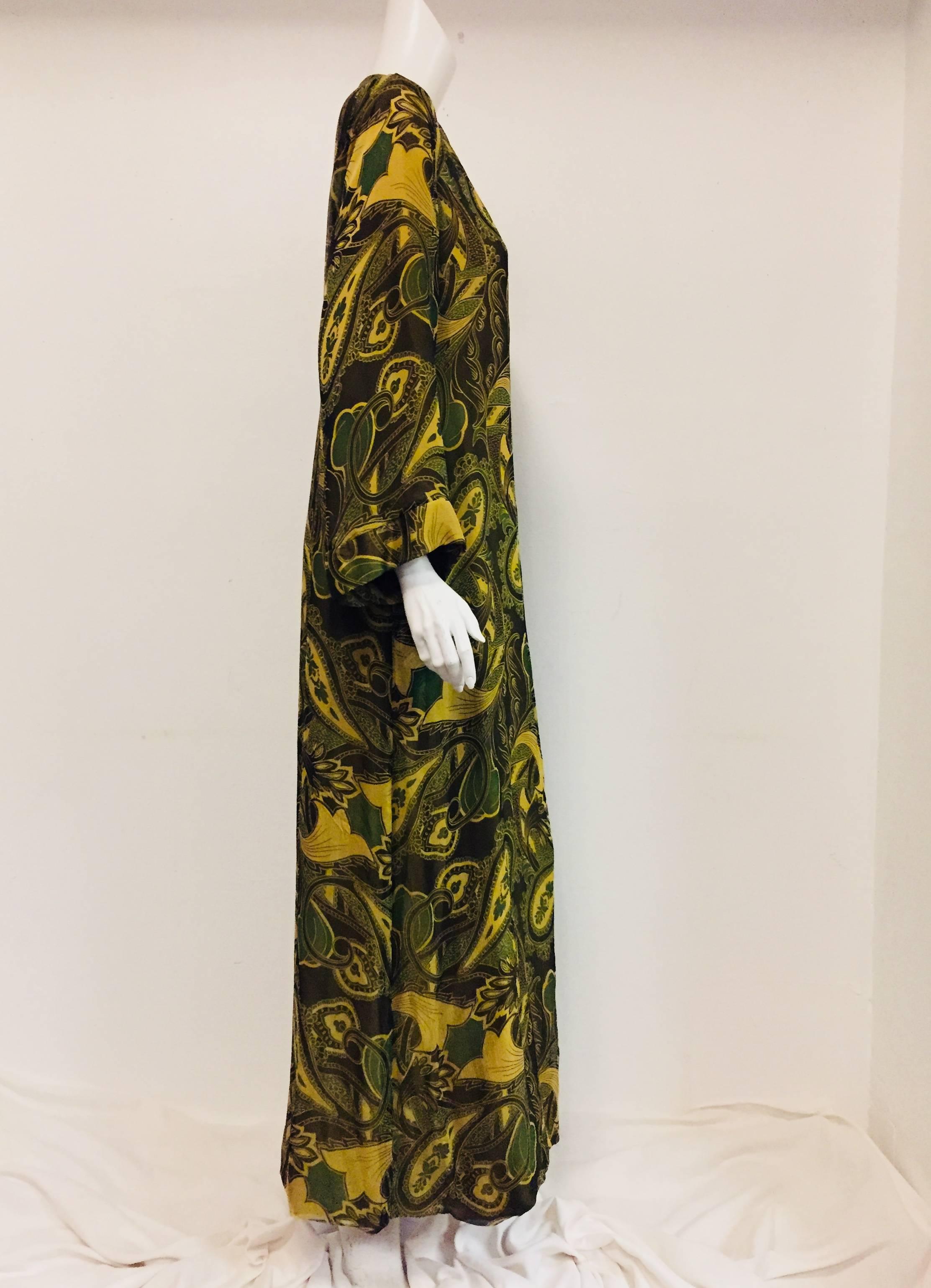 Cal Hon Hall green tones silk chiffon with long sleeves and zipper with small charm at front for closure.  This outstanding Caftan is great for any occasion, anytime and any season as it is a dress up or dress down garment.  The caftan is fully
