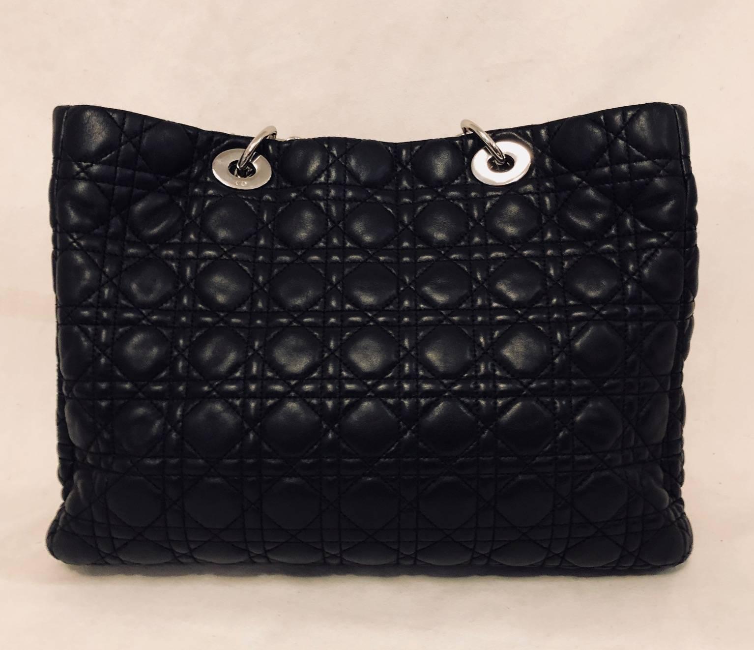 Christian Dior's signature Cannage quilted leather bags and accessories have become highly prized by socialites and celebrities alike!  Large shopping tote features ultra-luxurious lambskin, iconic stitched exterior, and two leather and silver tone