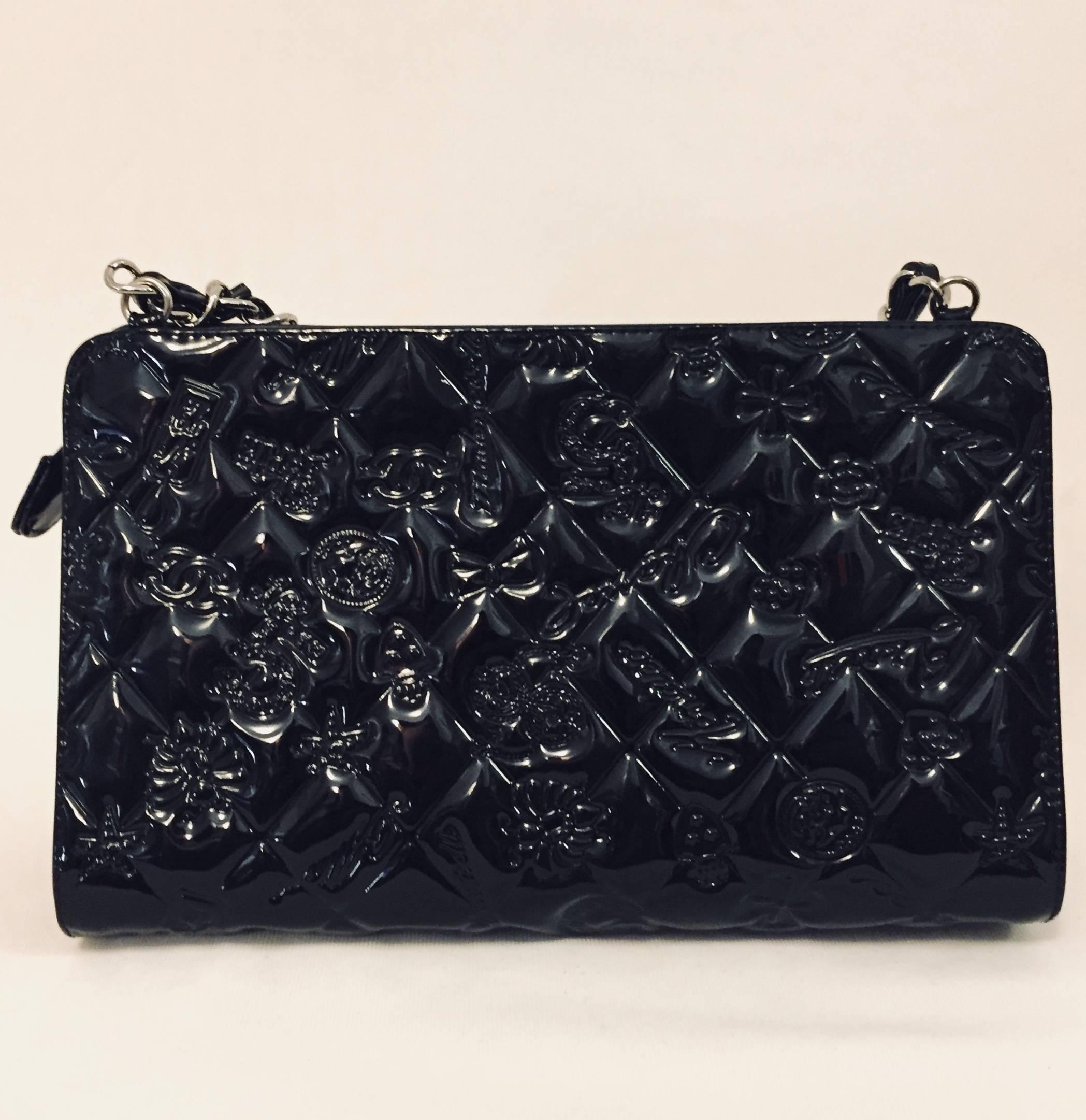 Fit for a lady, this petite Chanel shoulder bag is crafted from black patent leather allover and features interwoven silver tone chain.  Top zip closure.  The piece de resistance?  Front, back and bottom are diamond quilted and embossed with such