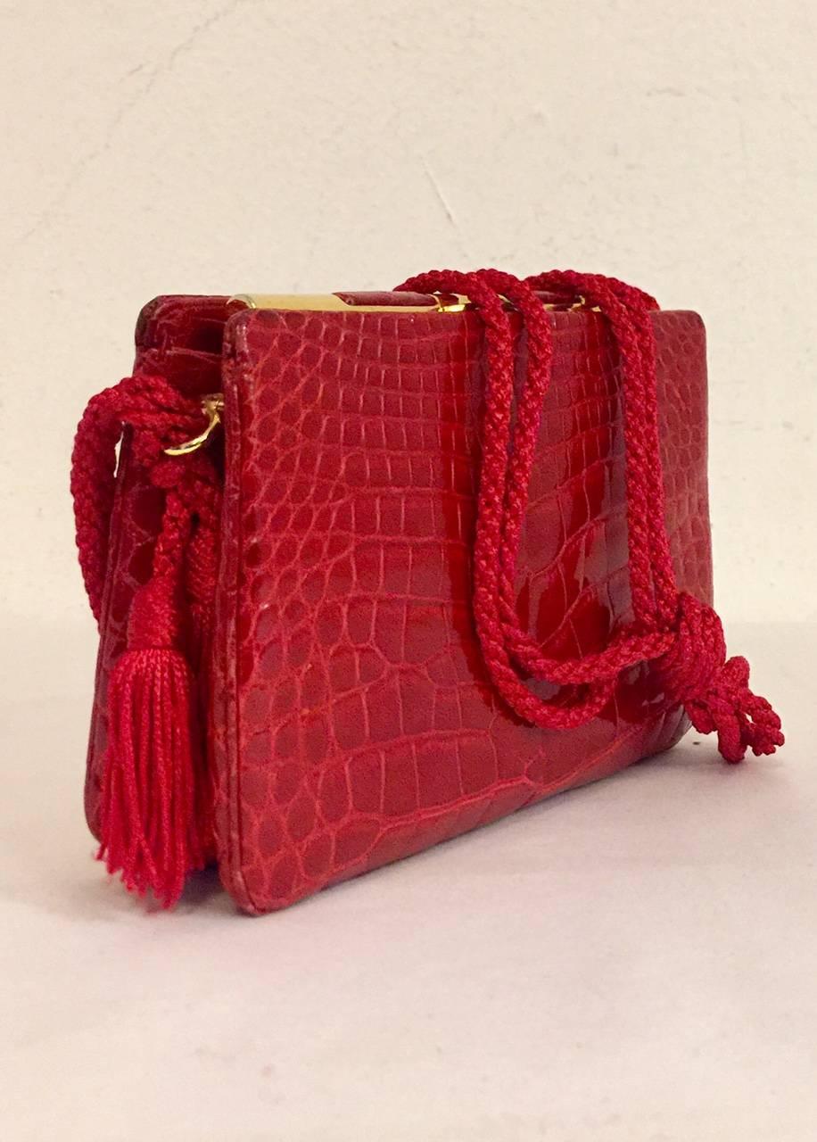 Vintage Judith Leiber Alligator shoulder bag proves that Judith Leiber is so much more than her famous minaudieres.  This bag features exquisite craftsmanship, two open side pockets and gold tone hardware including snap closure.  Interior frame