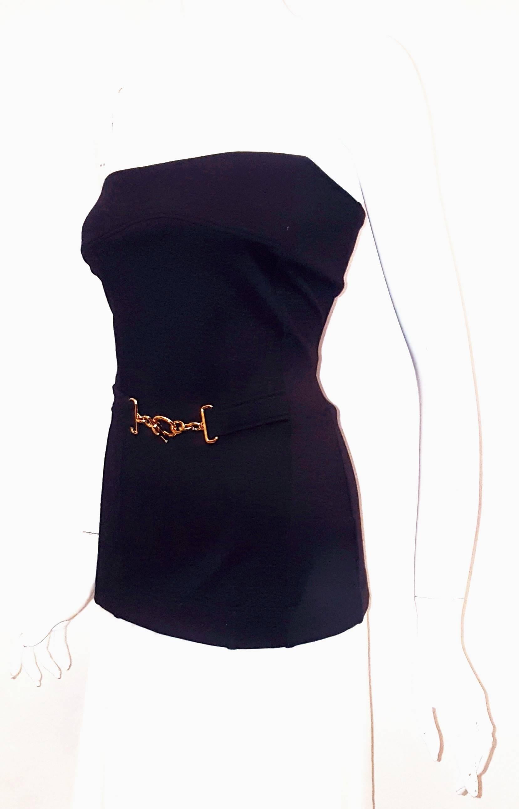 Gucci black wool blend strapless bustier is basic, almost unadorned, but exceptionally elegant.  The waist is cinched and adorned with a gold tone horse bit, so very chic and so very Gucci!  This top is not lined and is in excellent condition.  
The