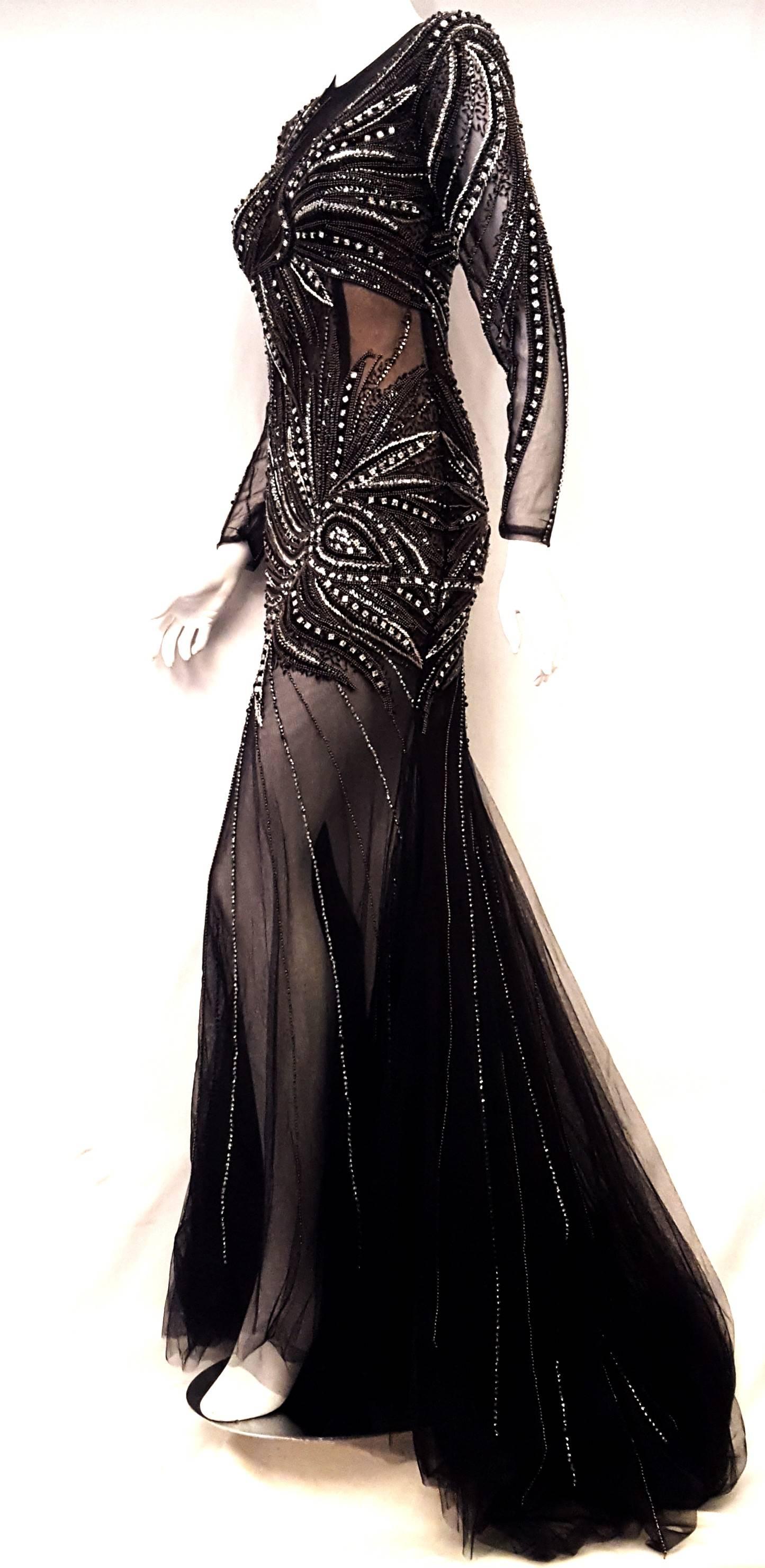 Forever Unique substantially beaded and partially transparent black dress defines sexiness!  The fabric and cut of the dress gives a beautiful shape to the body and as an added bonus it comes with a below the hip length spandex slip  underneath. 