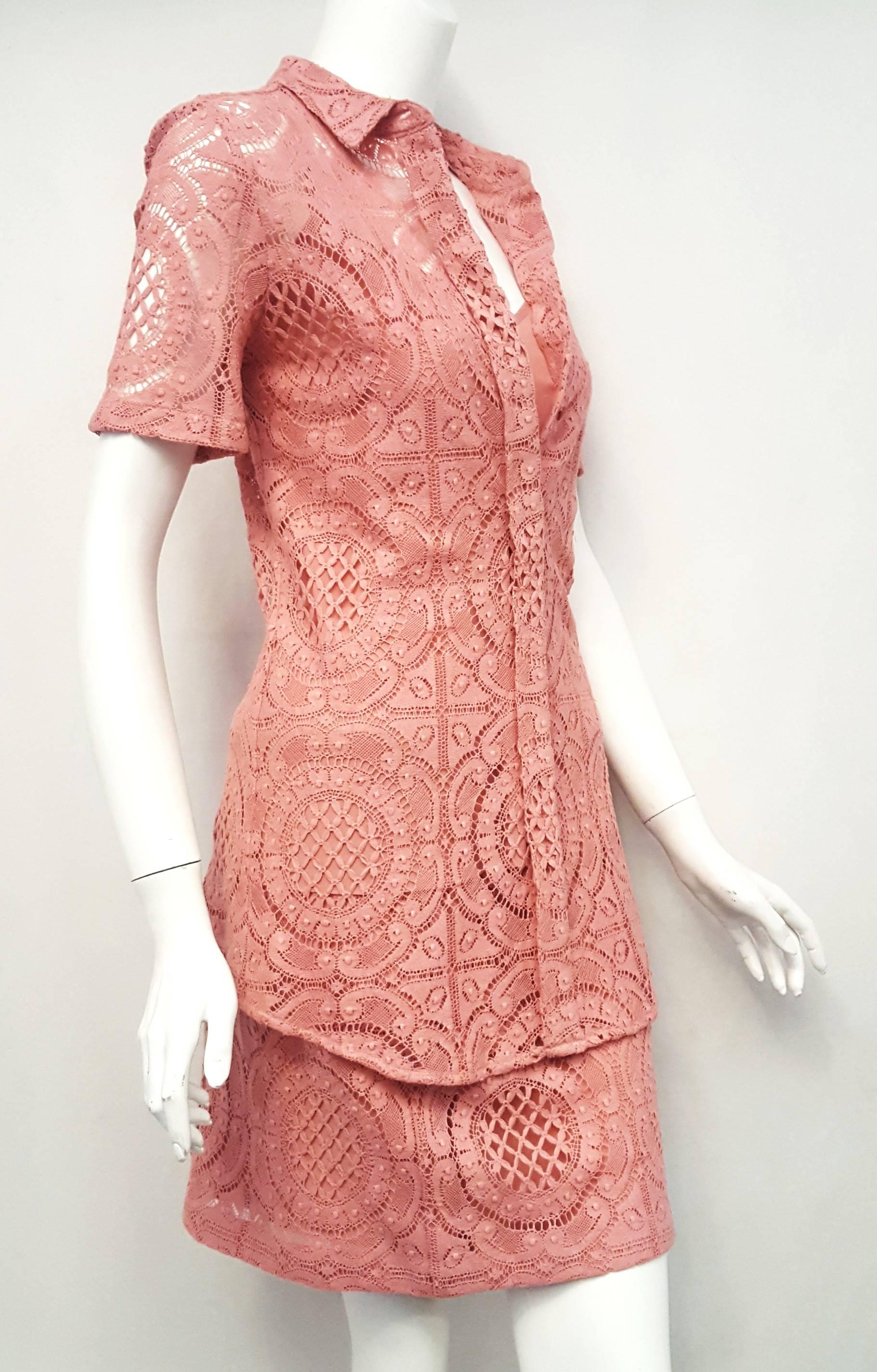 Burberry three piece pink ensemble with shirt top, skirt and camisole with short sleeve and shirt collar on the shirt features 8 Burberry buttons for closure.  The pink silk camisole has spaghetti straps and slight v neck and designed as an over the