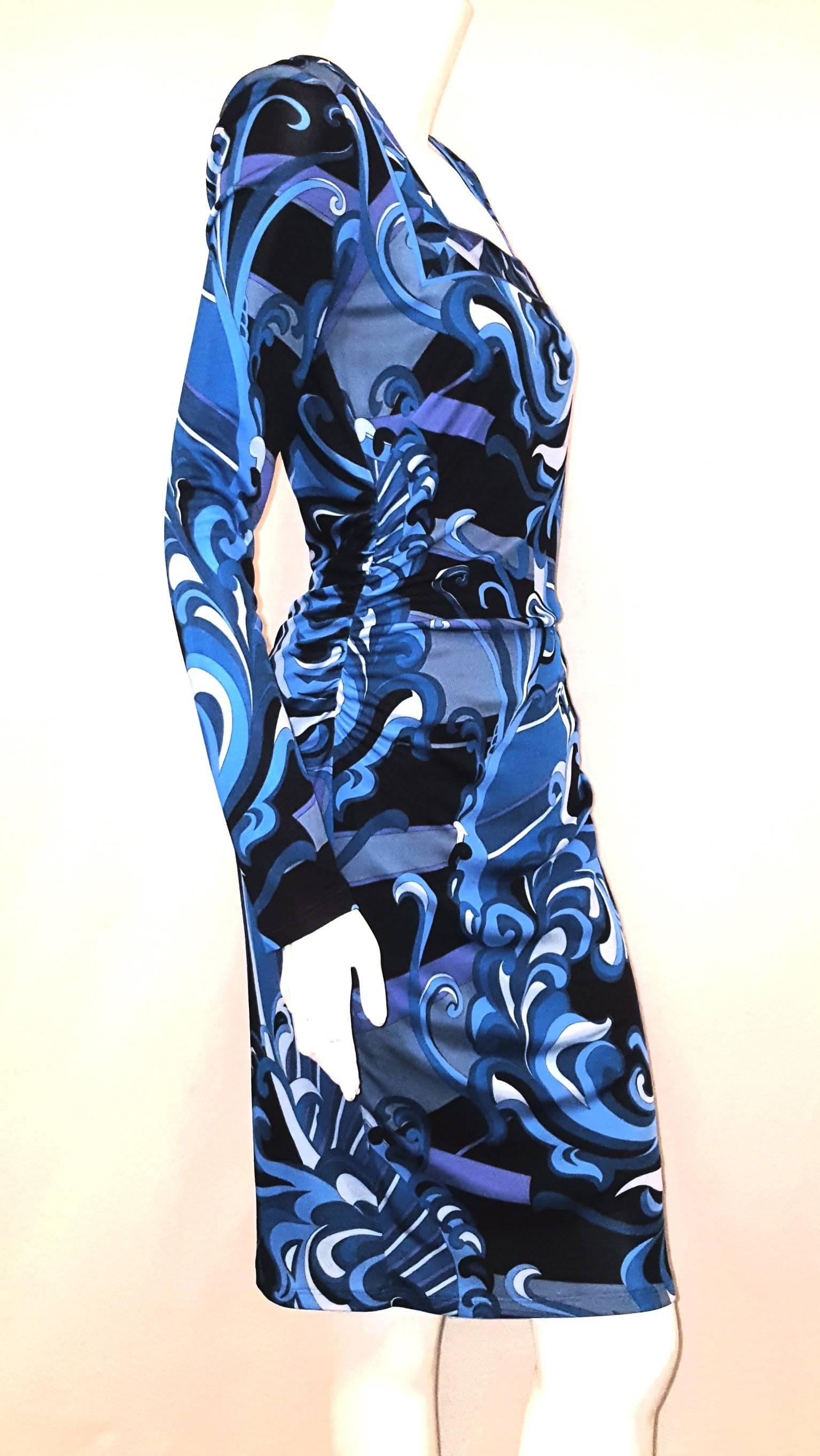 Emilio Pucci blue, turquoise, violet, grey and black abstract Pucci symbolic print dress with square neckline is such a wearable confection.
This stretch knit dress has ruching detail from the bust to the hip with hidden back zipper for closure. 