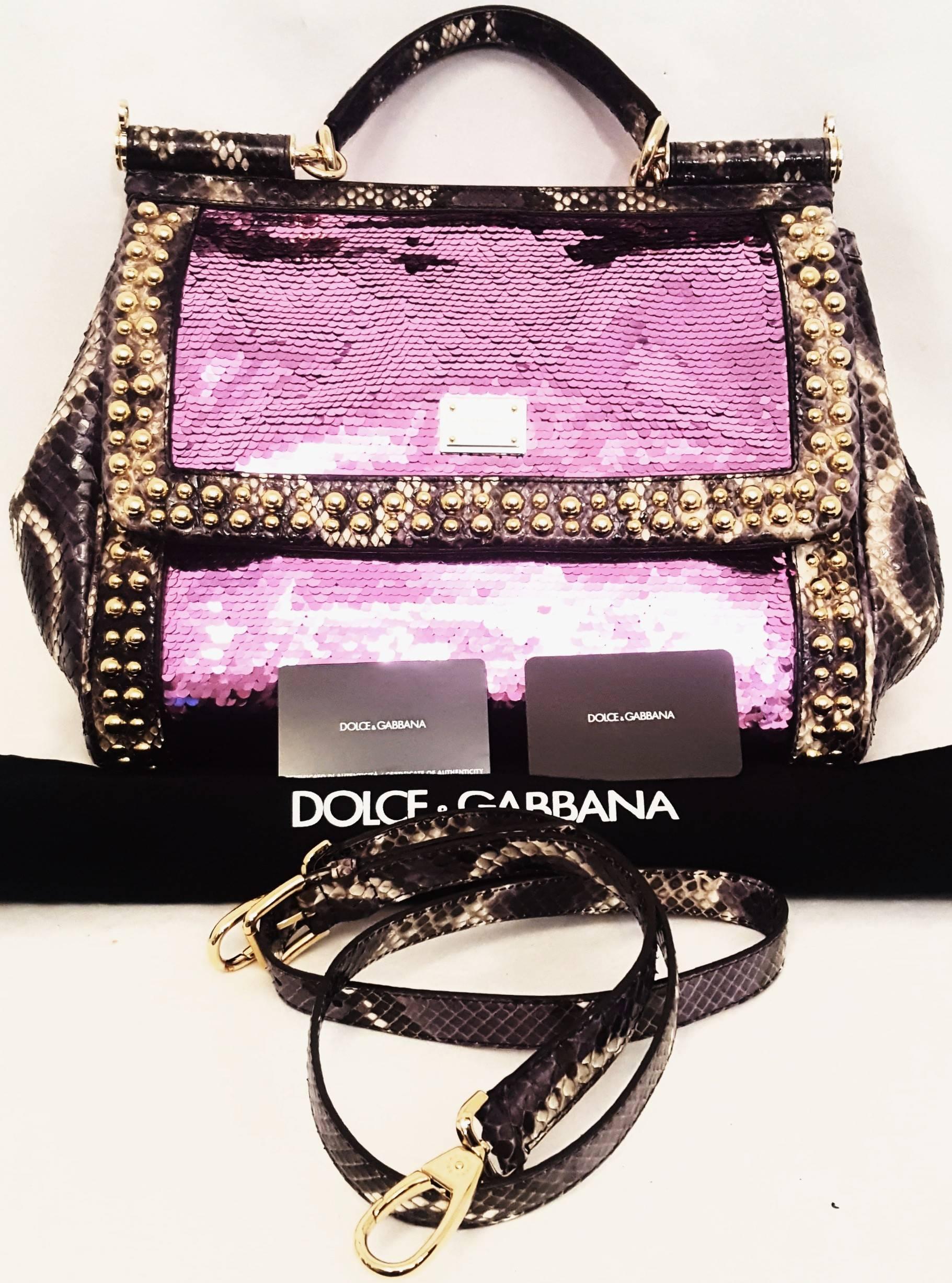 Dolce & Gabbana flashy Miss Sicily bag features purple, brown and ivory python trimmed on side panels and on the top handle. This Miss Sicily bag with gold-tone hardware including the gold tone studs around the flap and trim around the pink sequined
