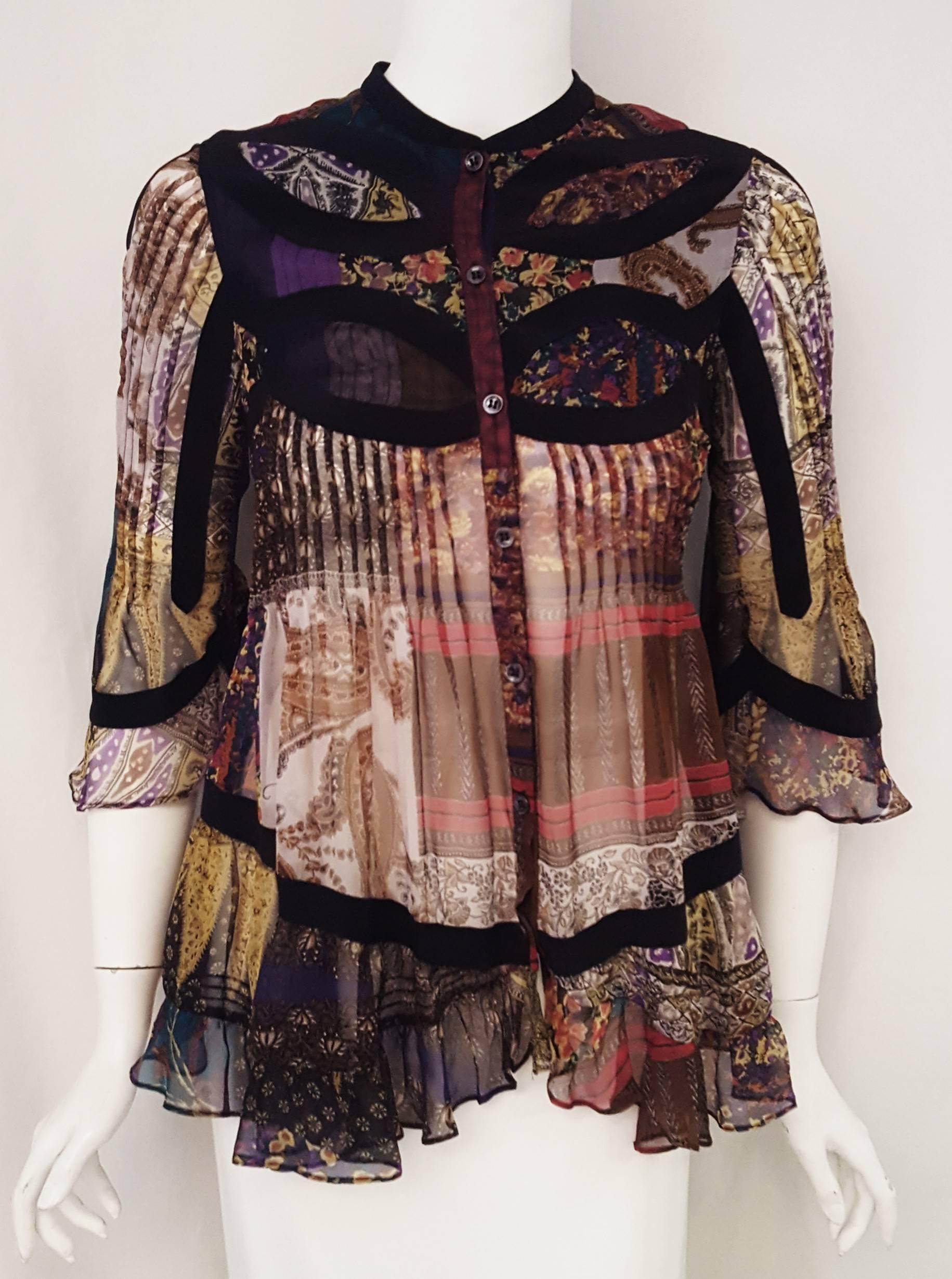 Etro blouse crafted from lightweight silk is colorful with high contrasting prints throughout.  This intricate design with black silk decorative inserts on the sleeves, upper chest and upper back and waistline area gives this top an eye catching
