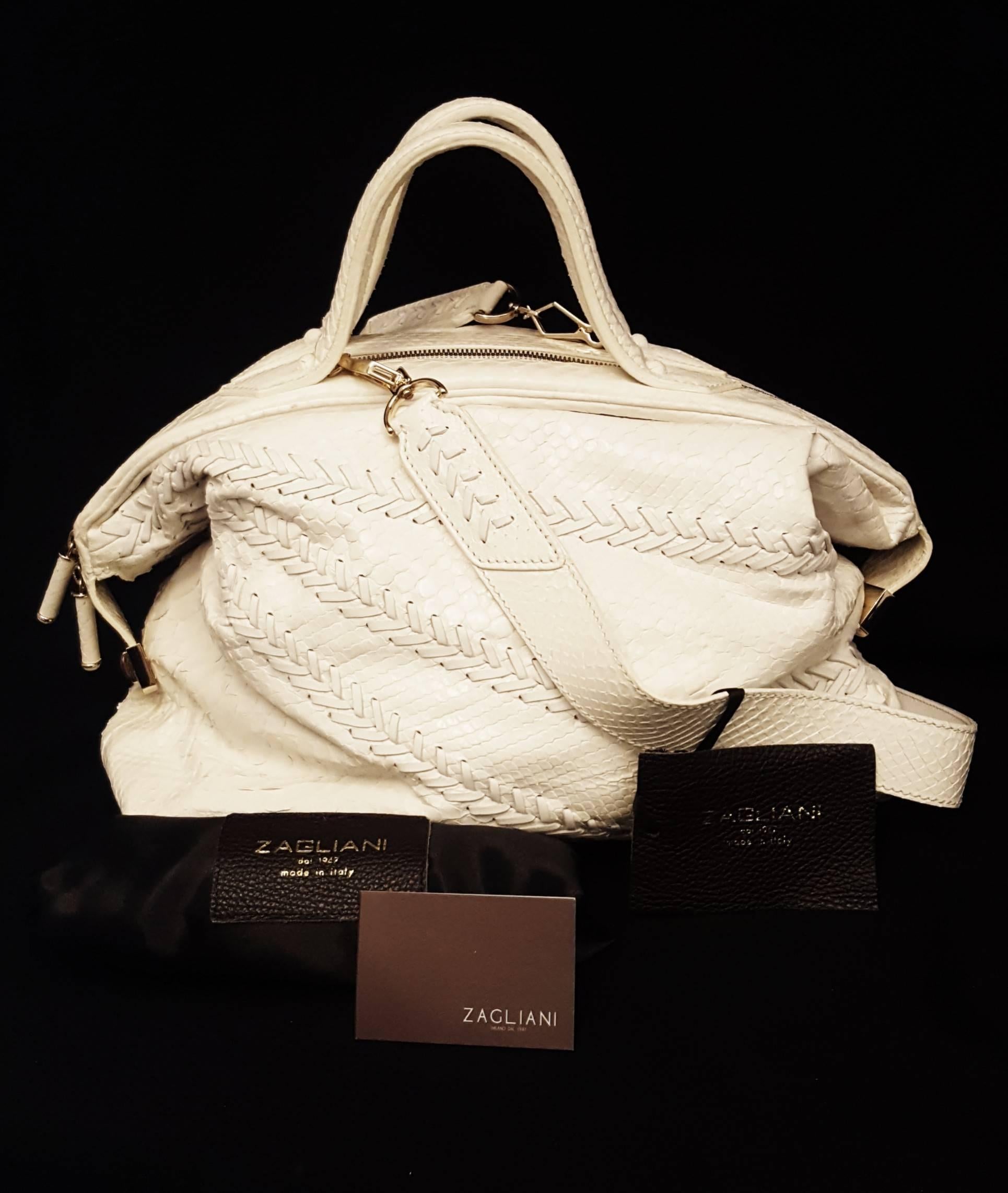 Zagliani ivory large python and leather Puffy bag is crafted by hand.   We rarely get to see a bag as gorgeous as this one. Every feature on it is awe inspiring which makes the piece all the more worthy of being owned. The Zagliani Puffy tote has