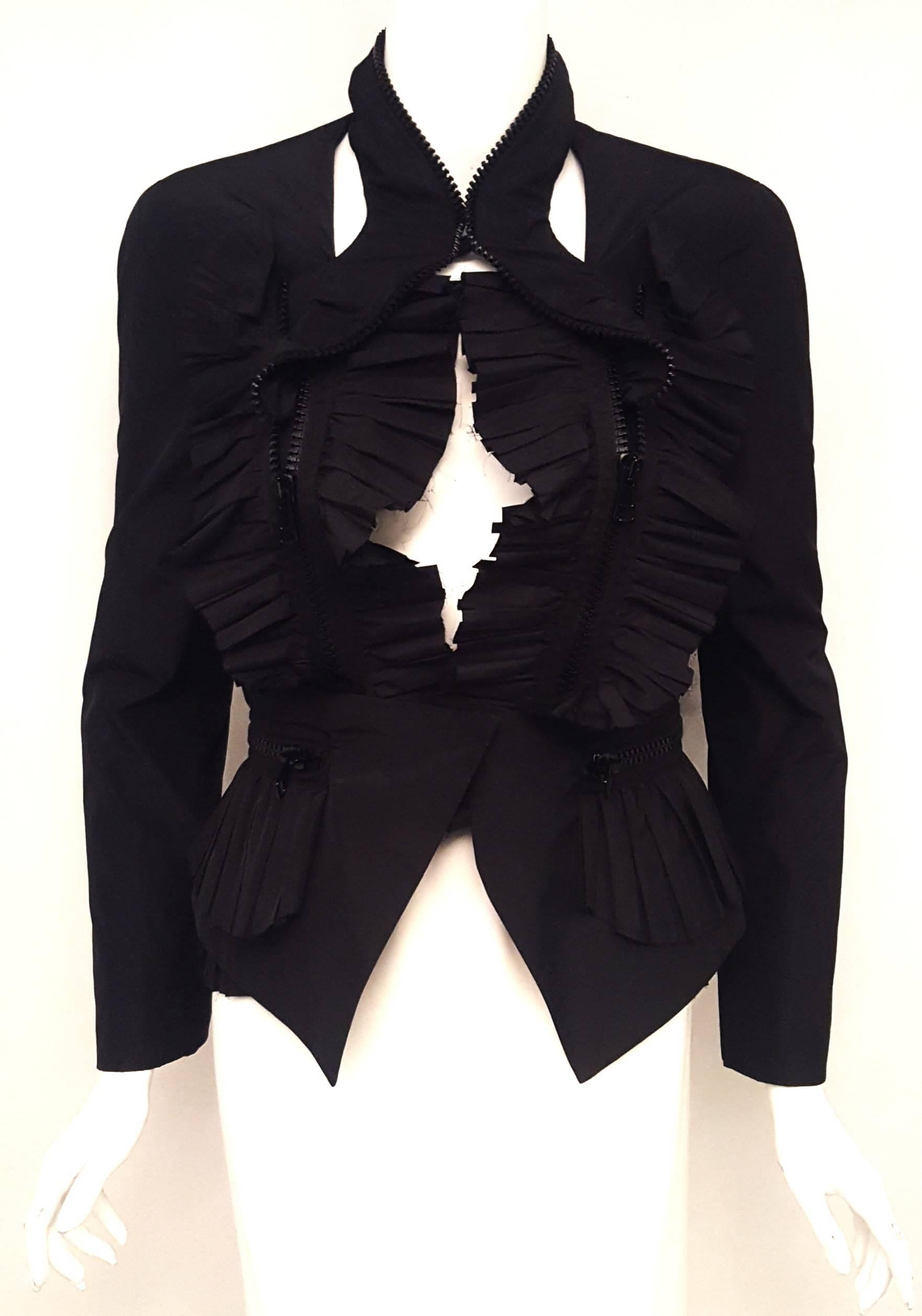 Givenchy black pleated jacket with multi zippers throughout the garment that transform this top from classic to trendy!  Sure to please the discerning fashionistas!