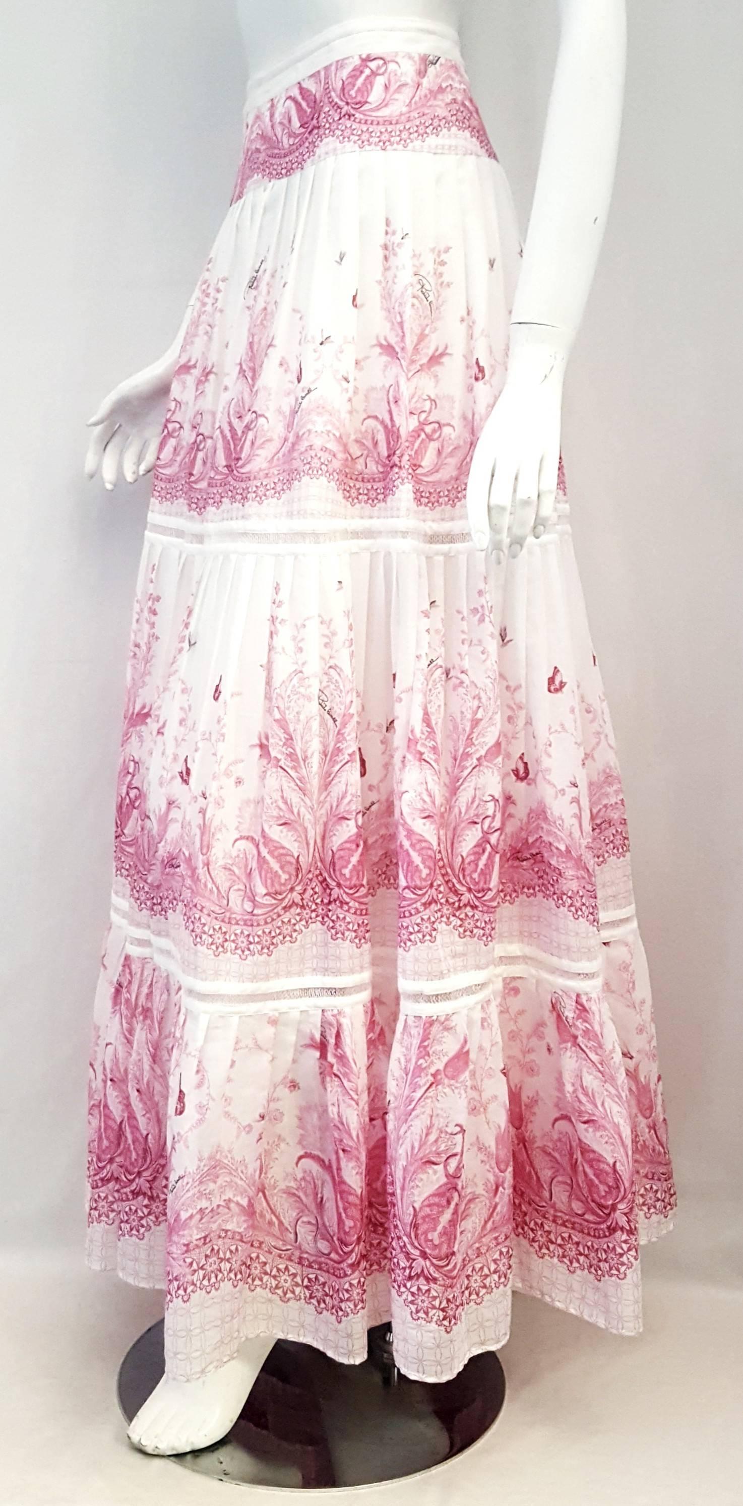 Roberto Cavalli pink and white cotton voile long casual pleated skirt from the waist with lace bands inserted in between the cotton floral print panels features fluttering butterflies.  This romantic Italian countryside peasant print is excellent