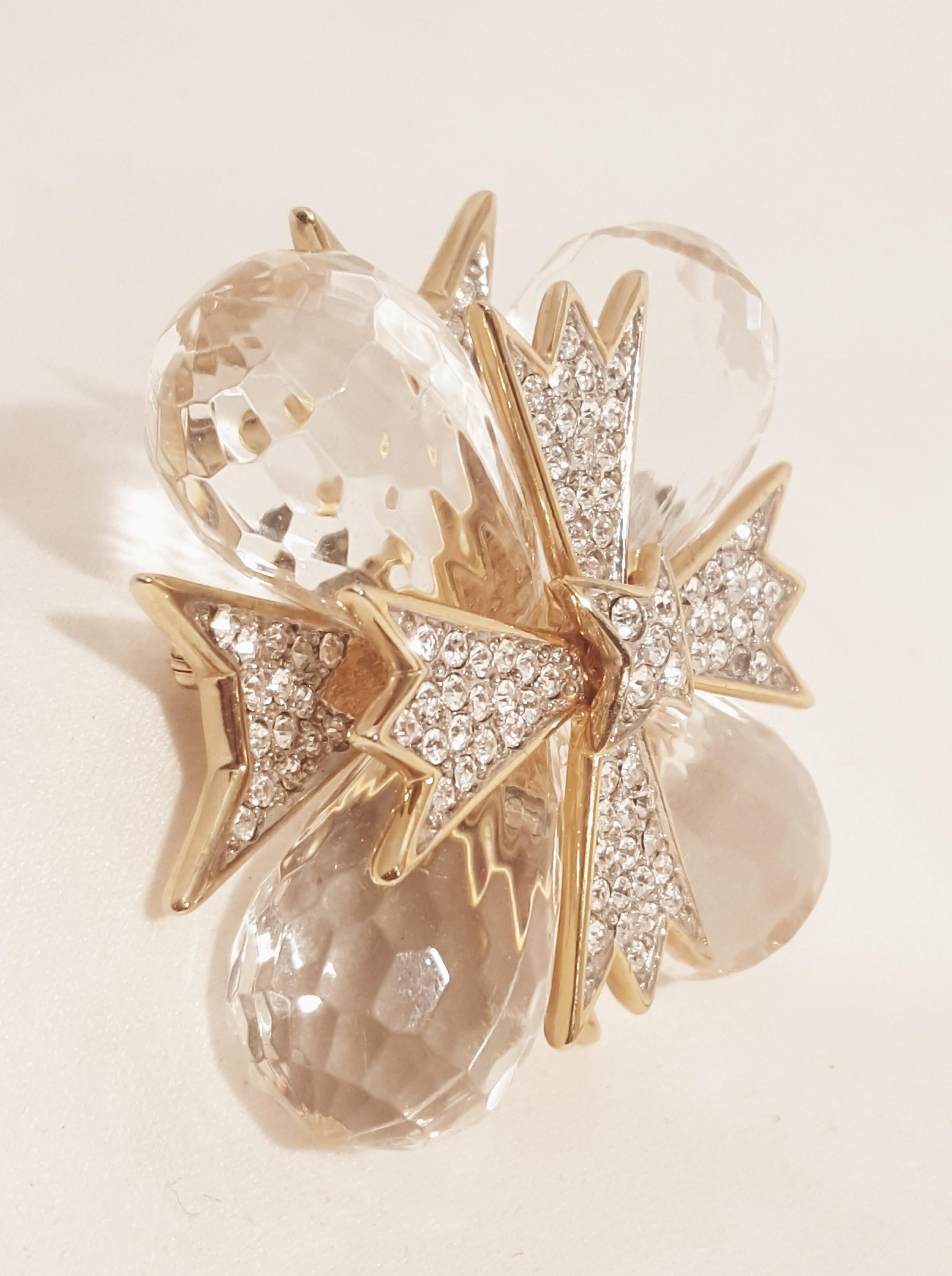 Kenneth Lane pieces, since his passing, have become highly collectible!  This fabulous brooch features two dimensional design with an upper and lower level.  Corners are strikingly stunning lucite briolettes.  Focal point is a Maltese cross