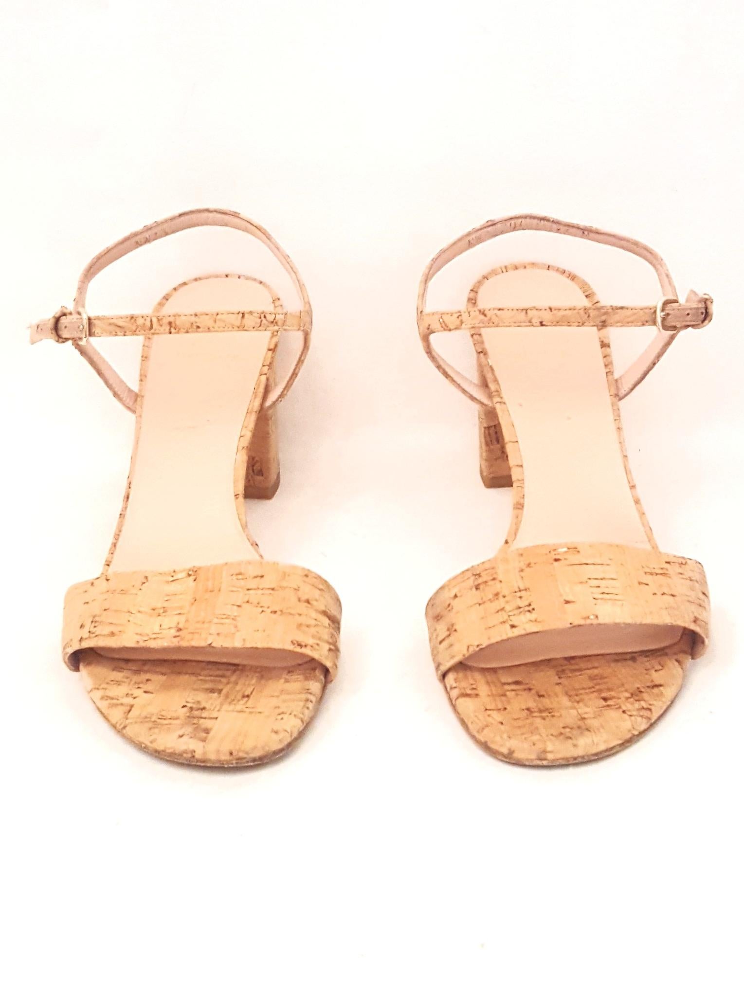 Stuart Weitzman Solo natural tone cork sandals with wide strap across open toe are the perfect accessory for those end of the summer outfits to keep the summer season from ending.  Stretchy buckled halter is adjustable to fit you correctly.  These