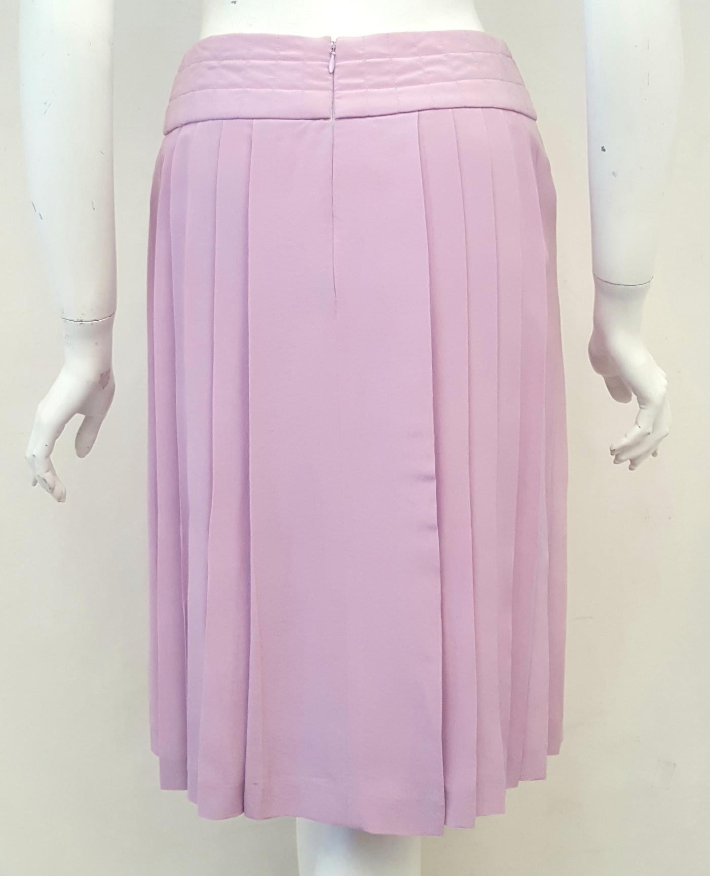 Chanel lavender silk pleated skirt featuring a horizontal pleated waistband and iconic Chanel mini plaque to one side.  This is such a sexy skirt when walking, it just swings with you!  Fabulous with black top or Chanel jacket finished with a Chanel