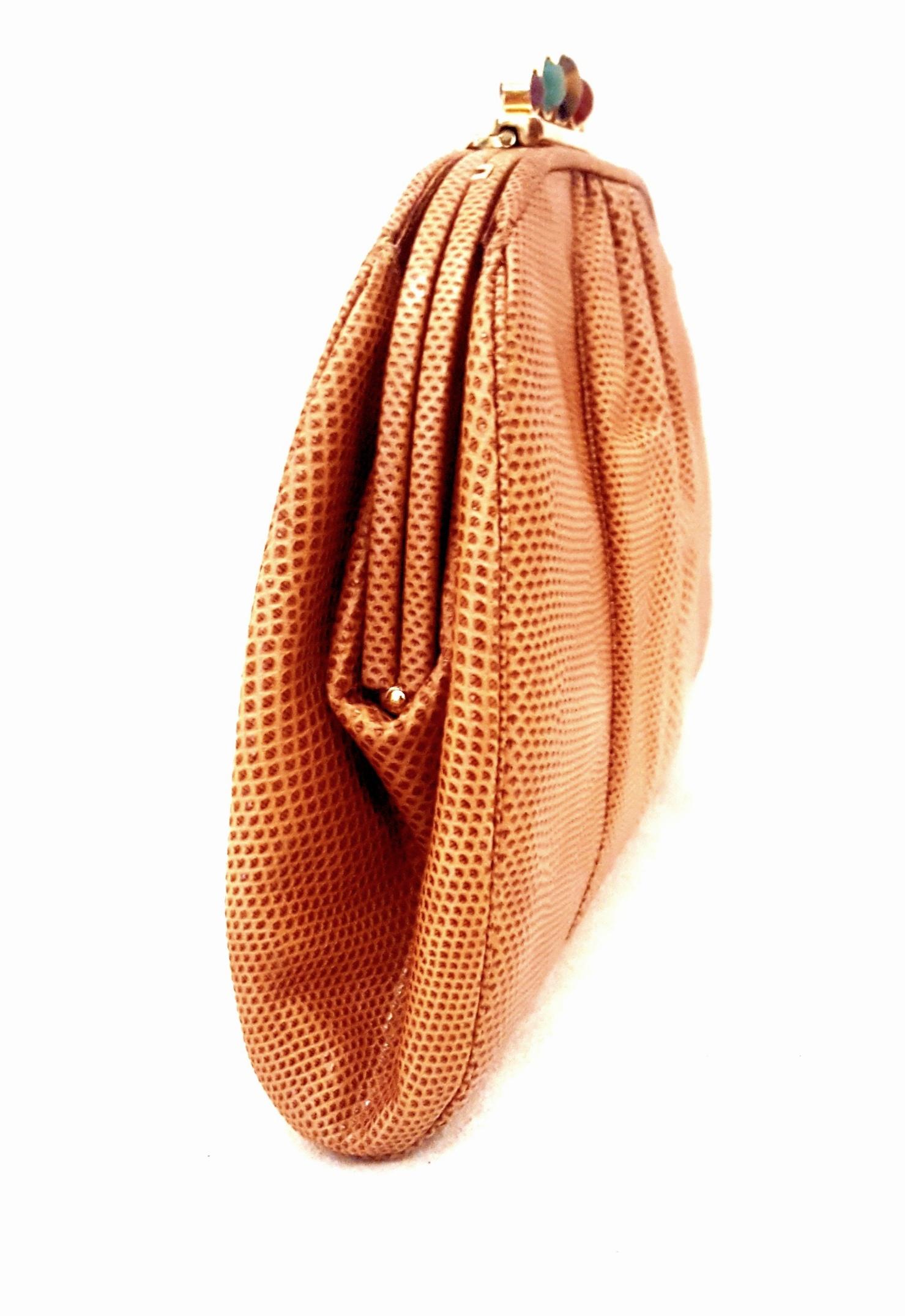Vintage Judith Leiber jeweled closure tan lizard convertible clutch/shoulder bag is highly desired by collectors of Judith Leiber.   This bag features slightly gathered, butter soft lizard skin.  It is larger than the typical Lebeir that easily