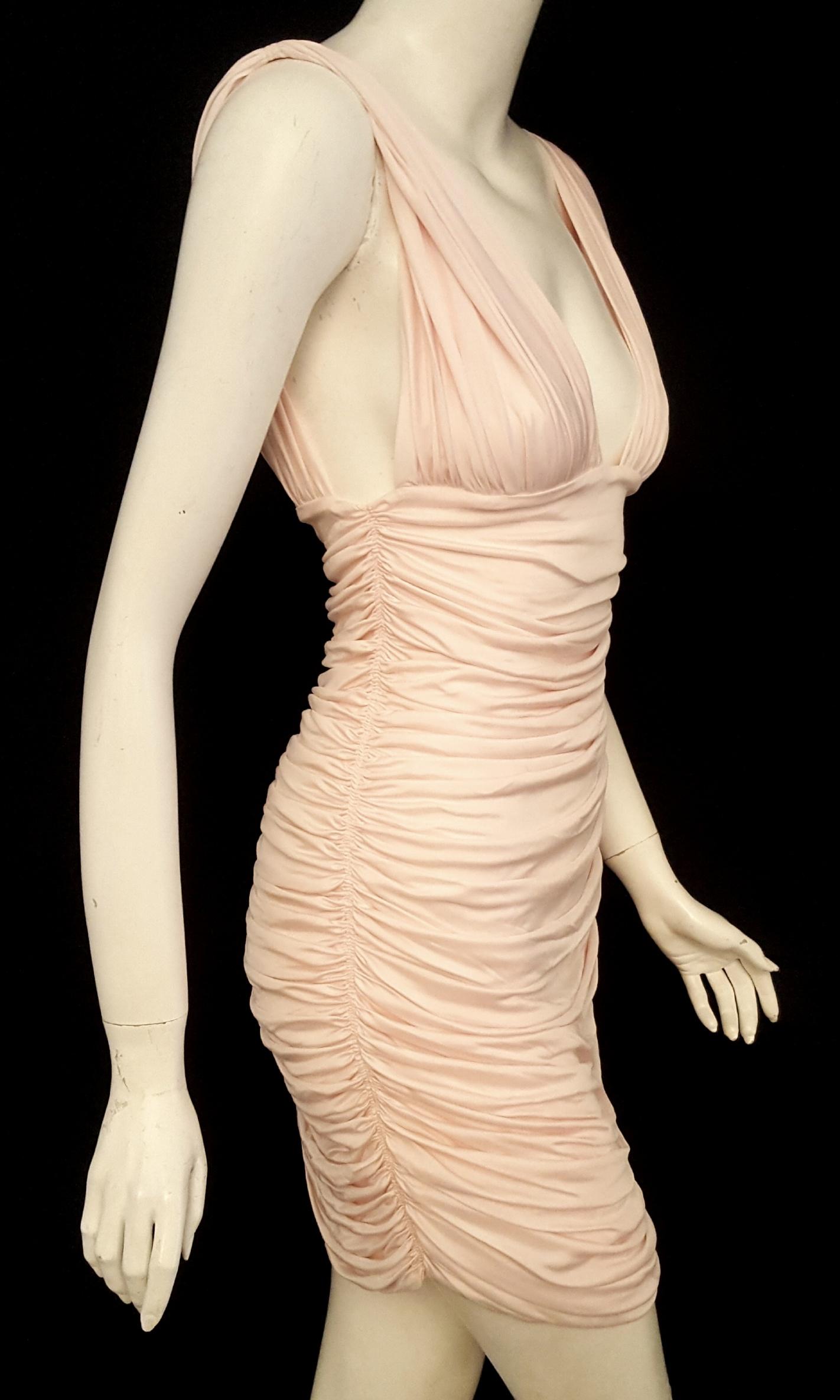 Balmain bodycon fit pink V neck with vertical ruching at front and back with so much attention to detail, has mirror lining so you can play with the shoulder straps to fit to your bustline.  Flattering, undulating horizontal ruching front and back. 