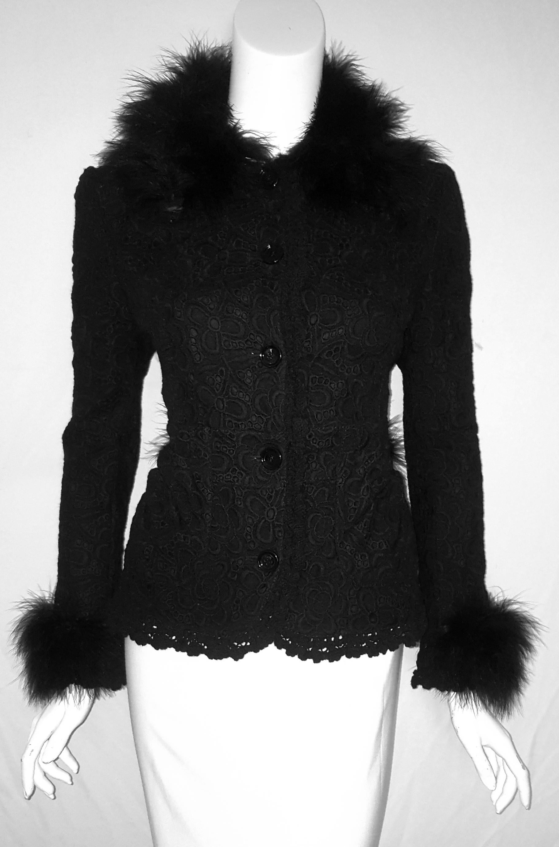 Dolce & Gabbana wool crochet jacket enhanced with turkey feathers on the collar, the cuffs and back belt.  The turkey feathers are as soft as ostrich feathers.  The hem of the jacket is crocheted in scalloped design starting at the collar coming