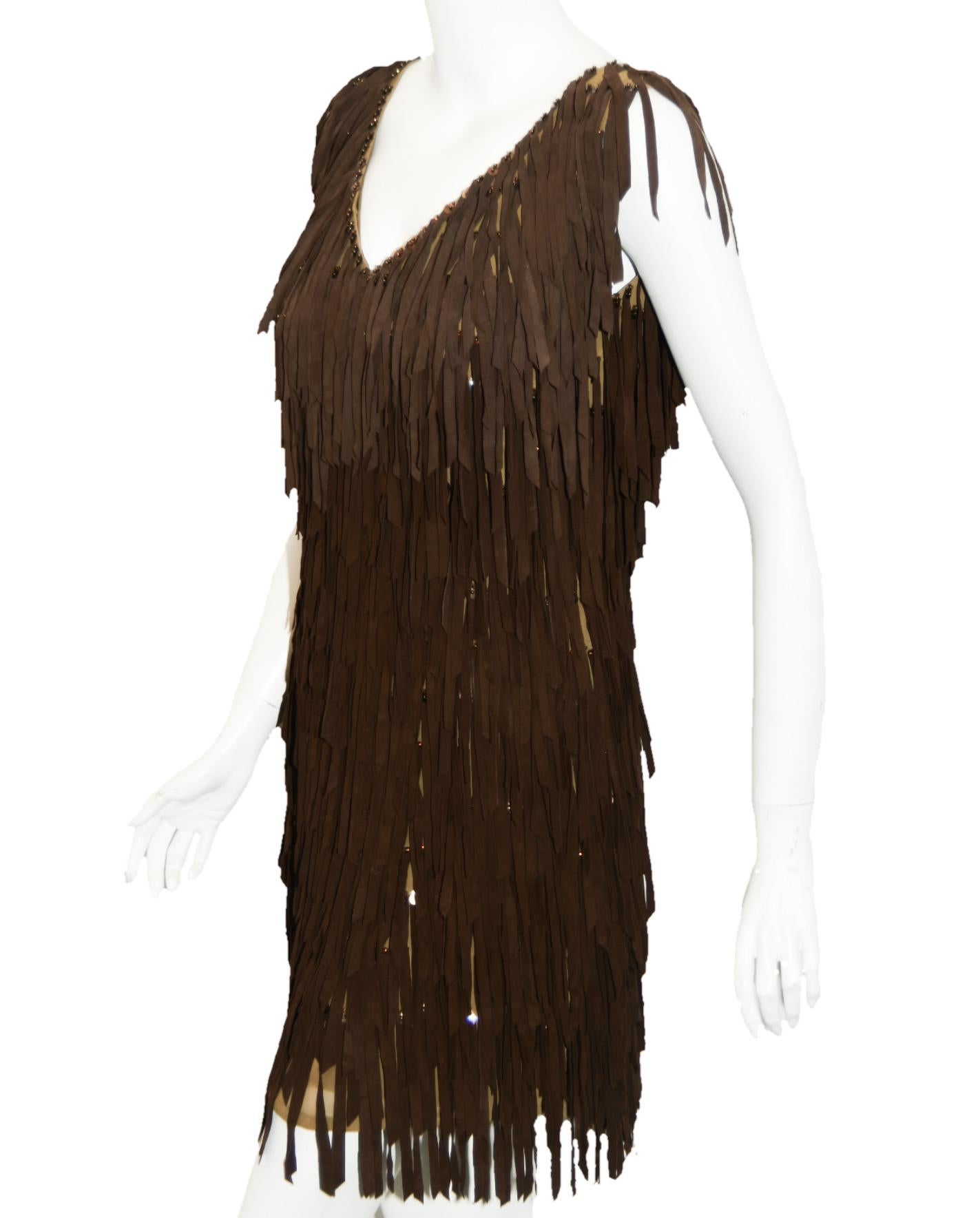 G-lish beaded fringe brown dress by which each fringe is individually attached to the tan silk chiffon dress with beads and sequins.  This gives the dress a finished handcrafted look.   Gabrielle Hoffman, after working with a number of top fashion