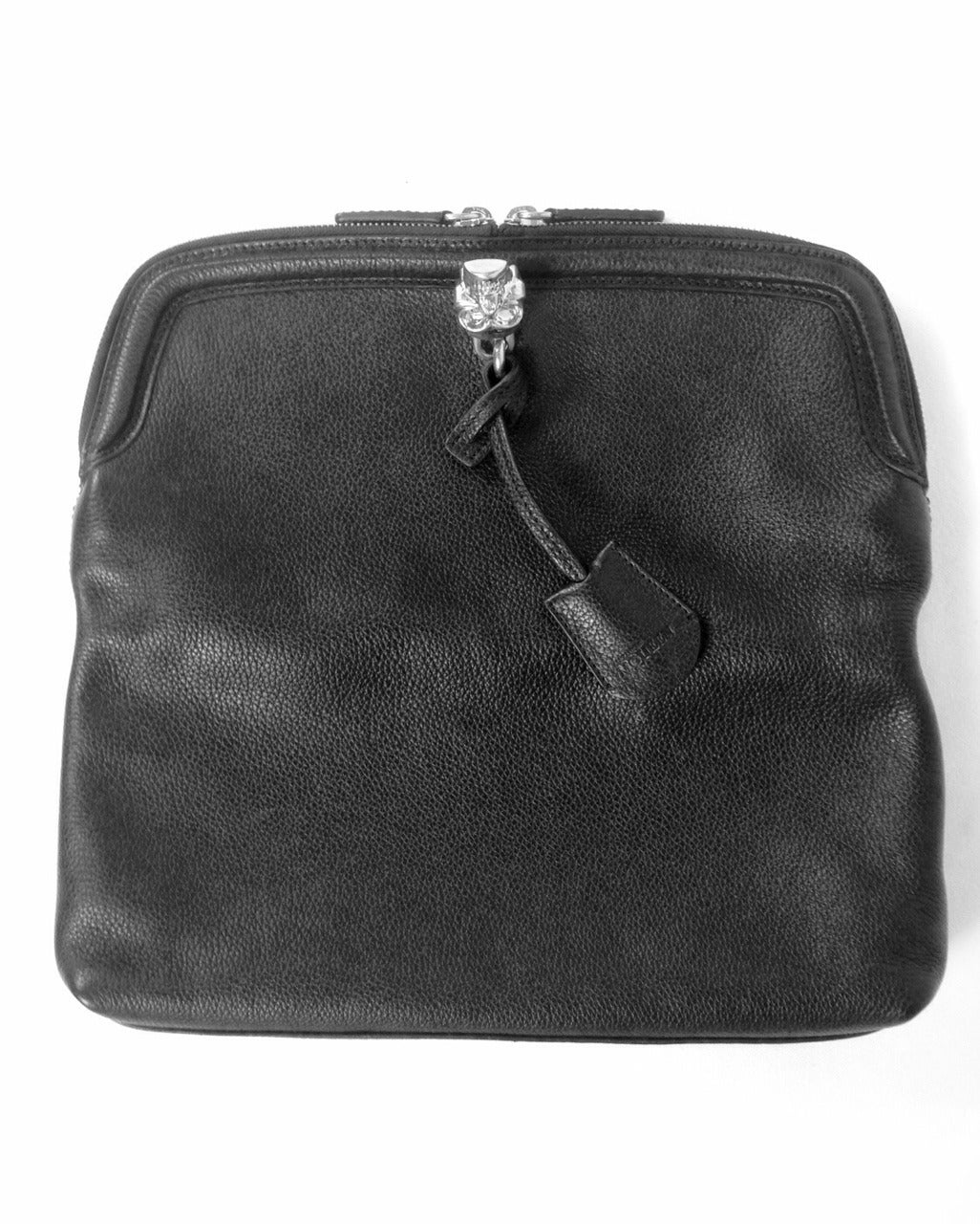 Alexander McQueen envelope clutch bag is a must for all collectors of this legendary designer.  Only the most luxurious butter-soft, textured leather would suffice!  Features contrast edging, piped trim and silver tone hardware.  The piece de