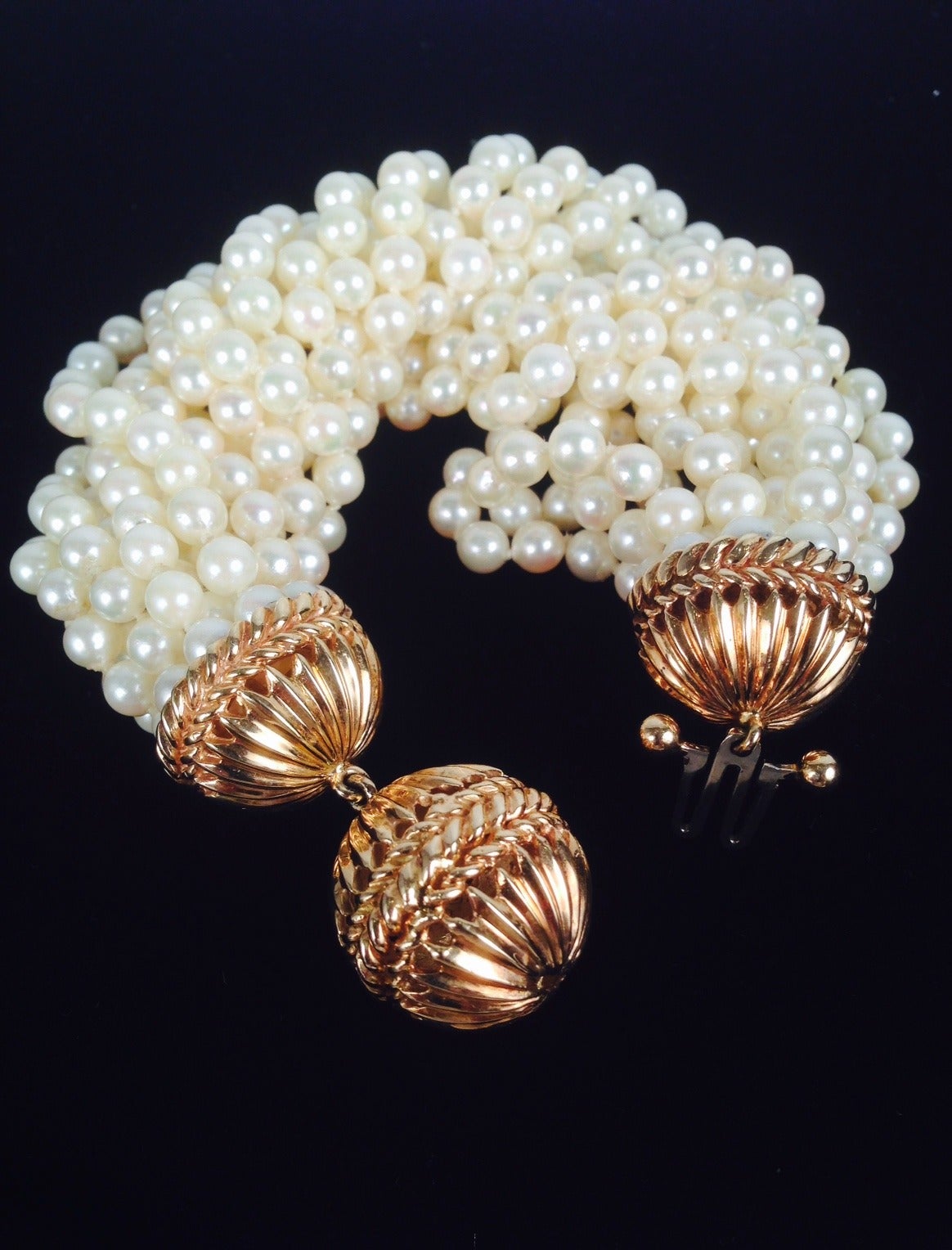 Multi-Strand Pearl Bracelet with Heavy Gold Clasp is classically elegant and fit for a lady!  Bracelet has 12 strands of cultured pearls approximately 5mm and heavy 14 karat yellow gold clasp and end caps.  Bracelet is 9