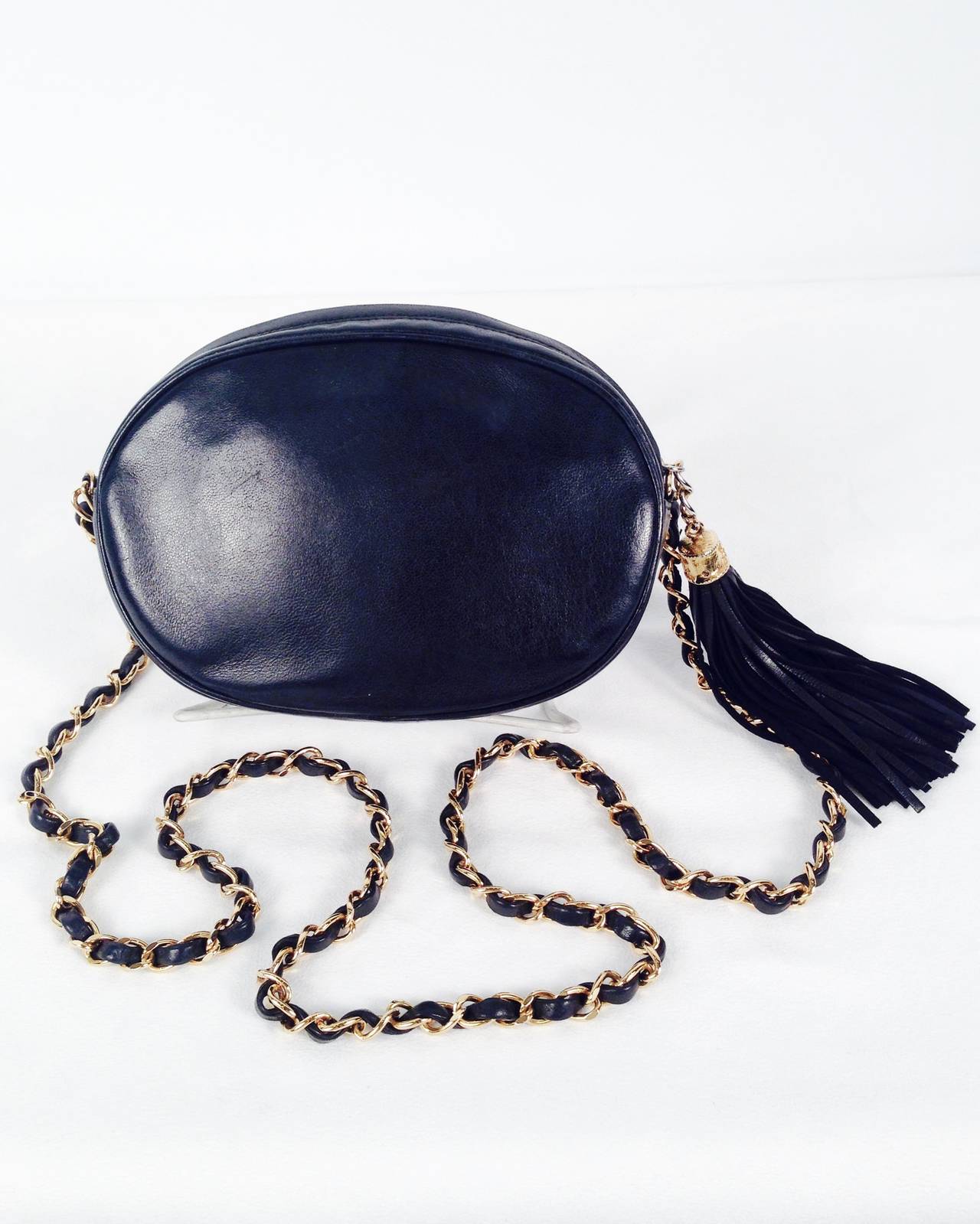 Live the fantasy with this vintage oval shoulder bag from Chanel!  Crafted between 1989 and 1991, bag features signature double 
