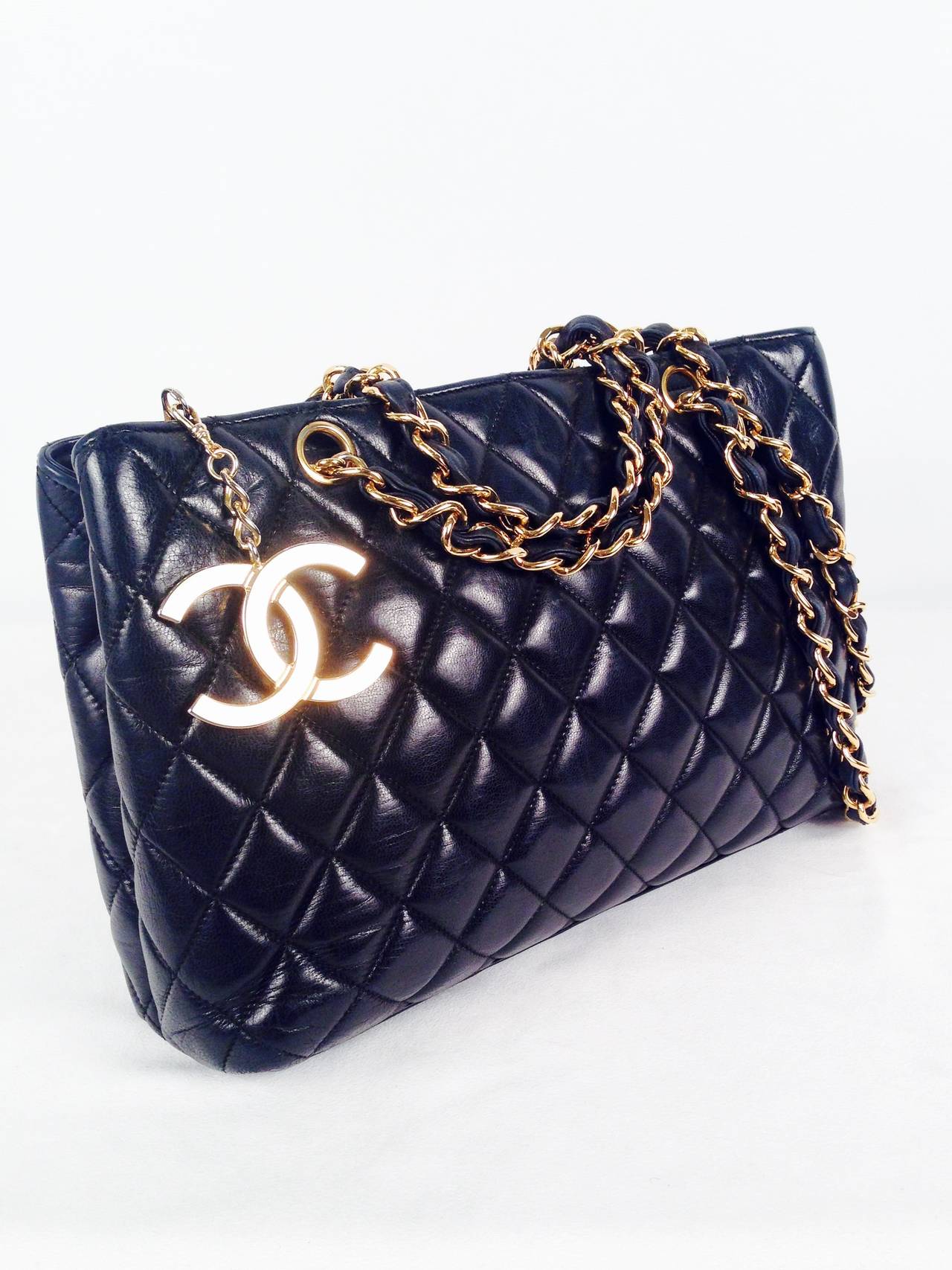 Simplicity and elegance at its best!  This vintage Chanel shoulder bag is in excellent condition.  Features signature quilted lambskin and gilt dual chains.  Top zipper.  Luxuriously lined in butter soft lambskin.  One interior zippered pocket with