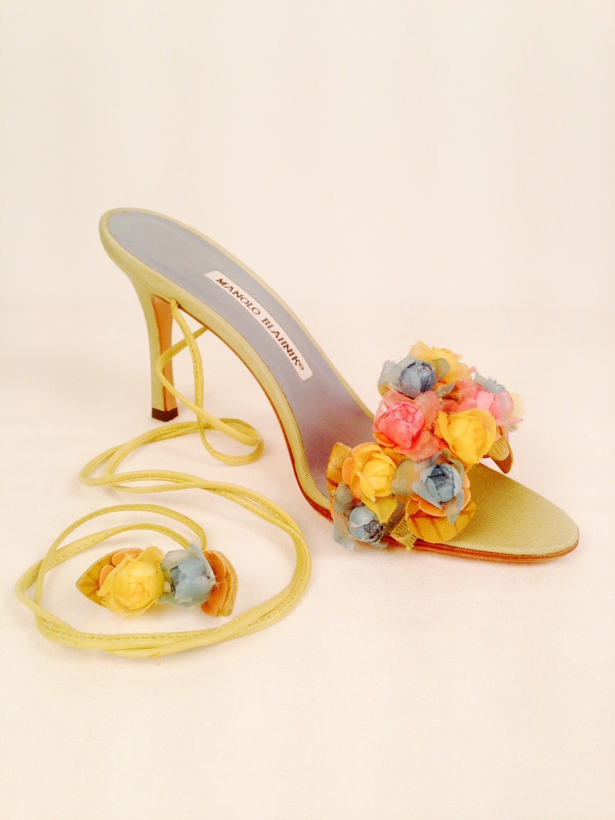 Sold out at Neiman Marcus at $830 per pair, these Manolo Blahnik Liseux Flower Ankle Tie Sandals will leave an unforgettable impression at tea!  New and never worn outside, ours are priced to sell!  Features chamomile silk twill and leather.  The