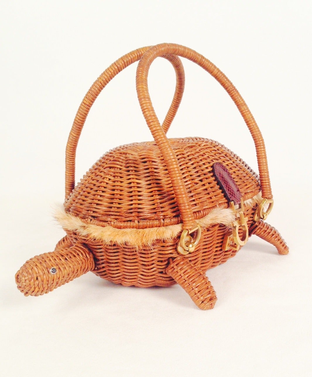 Salvatore Ferragamo Coyote Lined Wicker Turtle is whimsy defined!  Highly collectible and impossible to find, this delightful bag will amuse all admirers and start many conversations.  Signature 