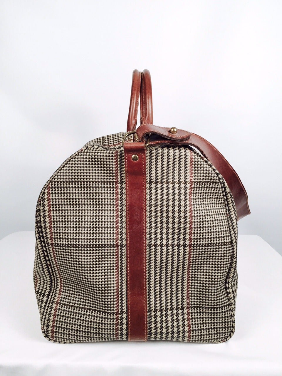Welcome to the American Dream world of Ralph Lauren!  Rare, vintage Polo herringbone plaid weekender shoulder duffel bag whispers the elegance and timeless style and aura of polo playing, yachting, sailing, horseback riding, and country clubbing. 