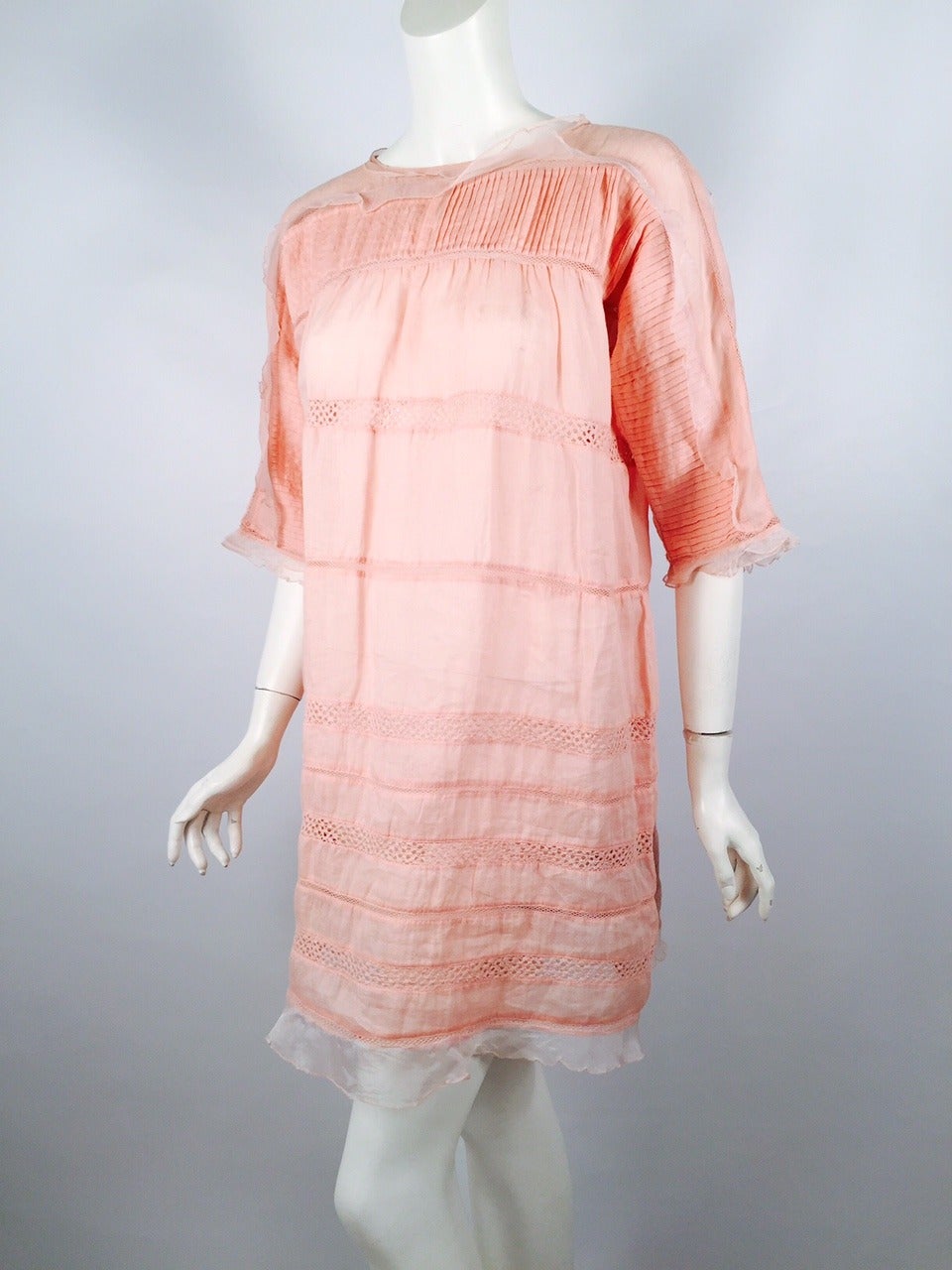 Isabel Marant Peach Ramie and Silk Dress is not only ultra-feminine, light, and ethereal.  This sublime and sophisticated confection is also the ultimate in Summer chic!  Features include round neckline, elbow length sleeves and generous silhouette.