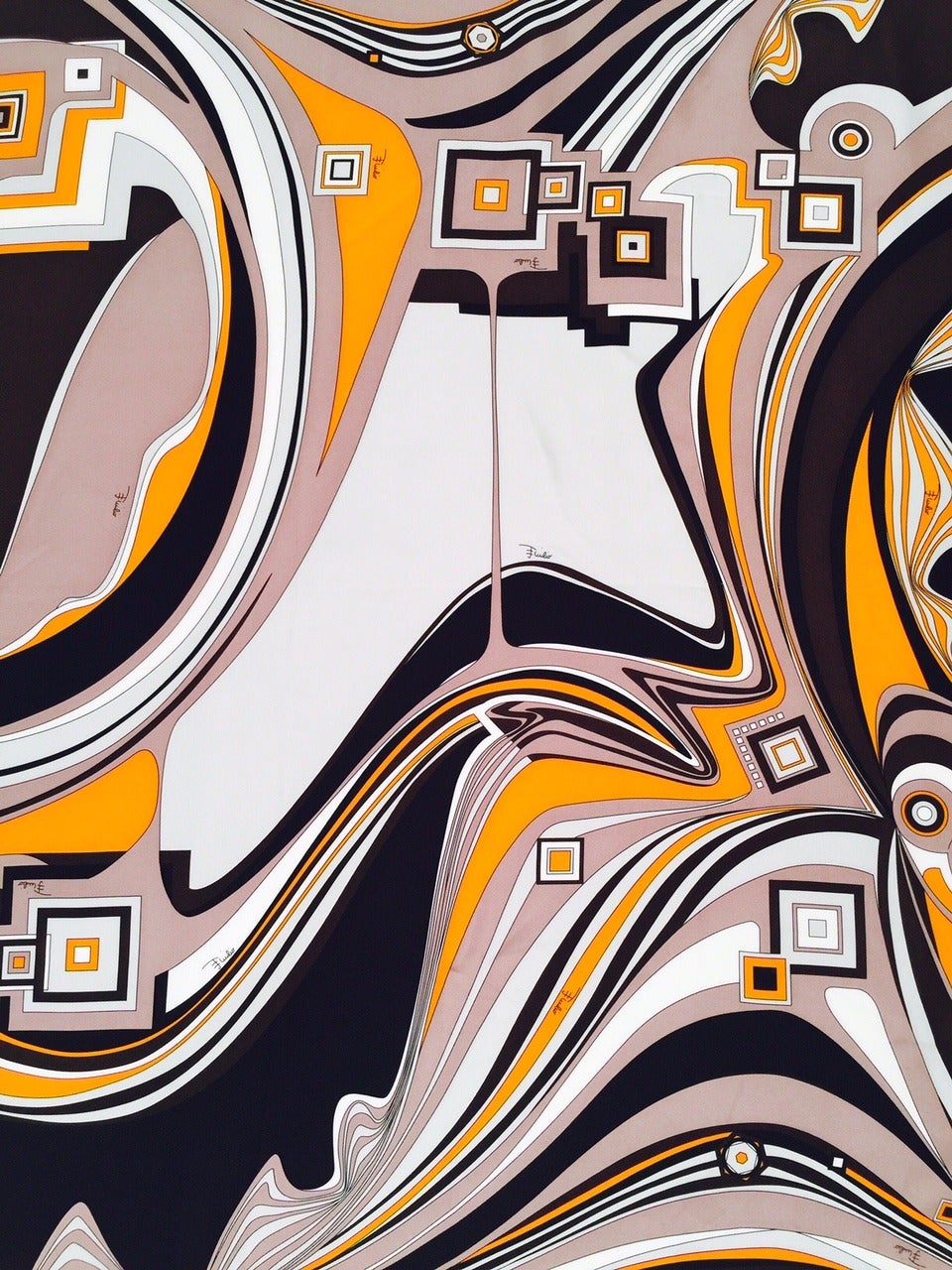 100% silk twill scarf is unmistakably Pucci!  Bold, geometric pattern in subdued shades of orange, black, chocolate and taupe creates a swirl of Italian high drama.  Classic and collectible.  Tie at the neck on a hand bag or, a la Jackie O, on your
