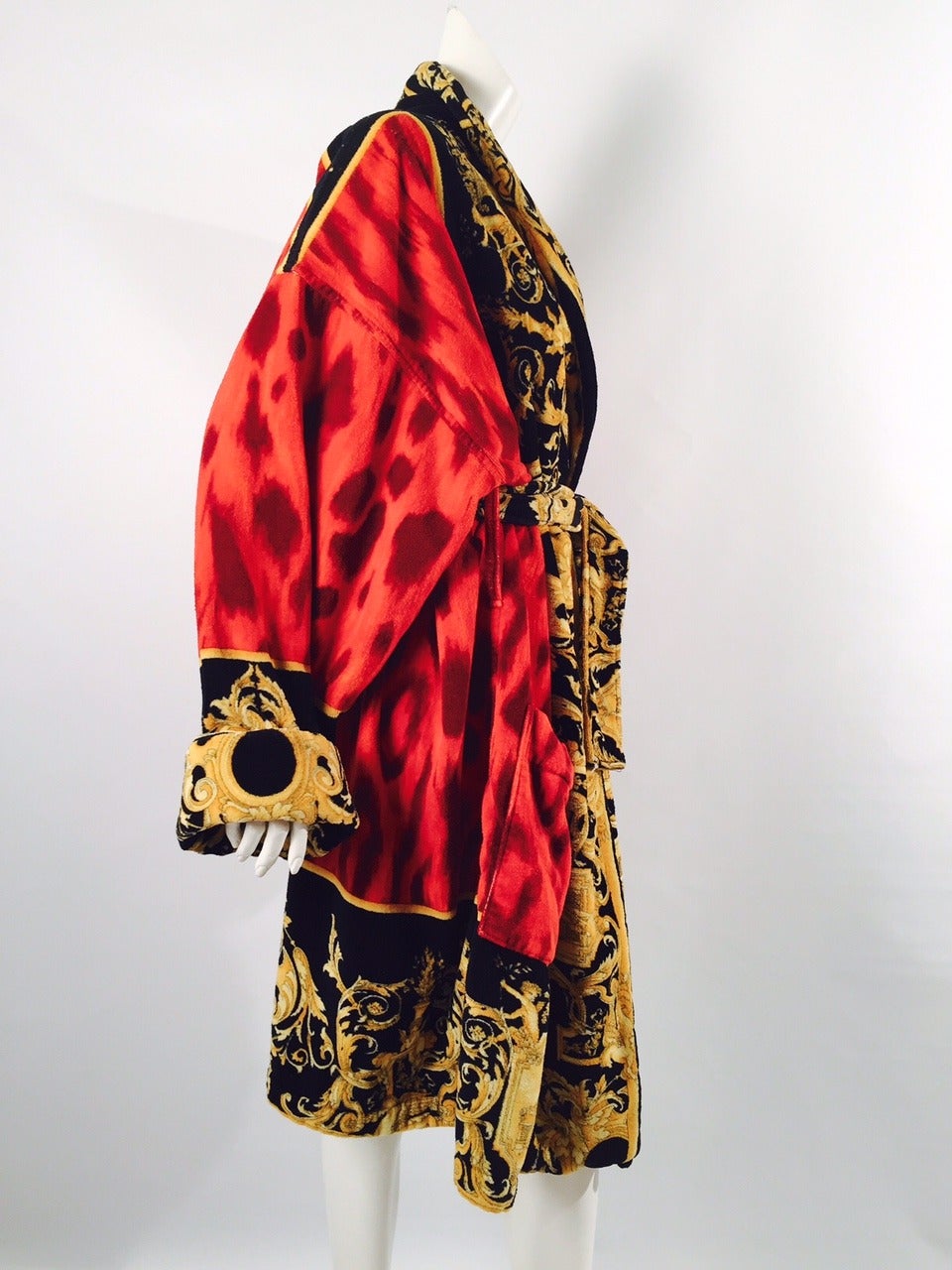 Vintage Gianni Versace Unisex Baroque Robe is a must for collectors of all things Versace!  Features ultra-luxurious cotton and signature print that incorporates playful cherubs and gilded scroll work!  Belted and perfect for a man or a woman.  Rich