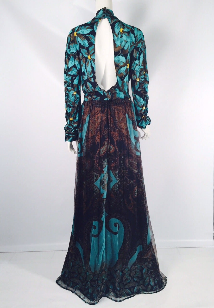 New CLASS Roberto Cavalli Long Sleeve Evening Gown is high on drama!  Features  colorful print composed of various earth tones, including ochre, turquoise, carob and black.  Bodice and sleeves have leaf print, while skirt's print celebrates leaves