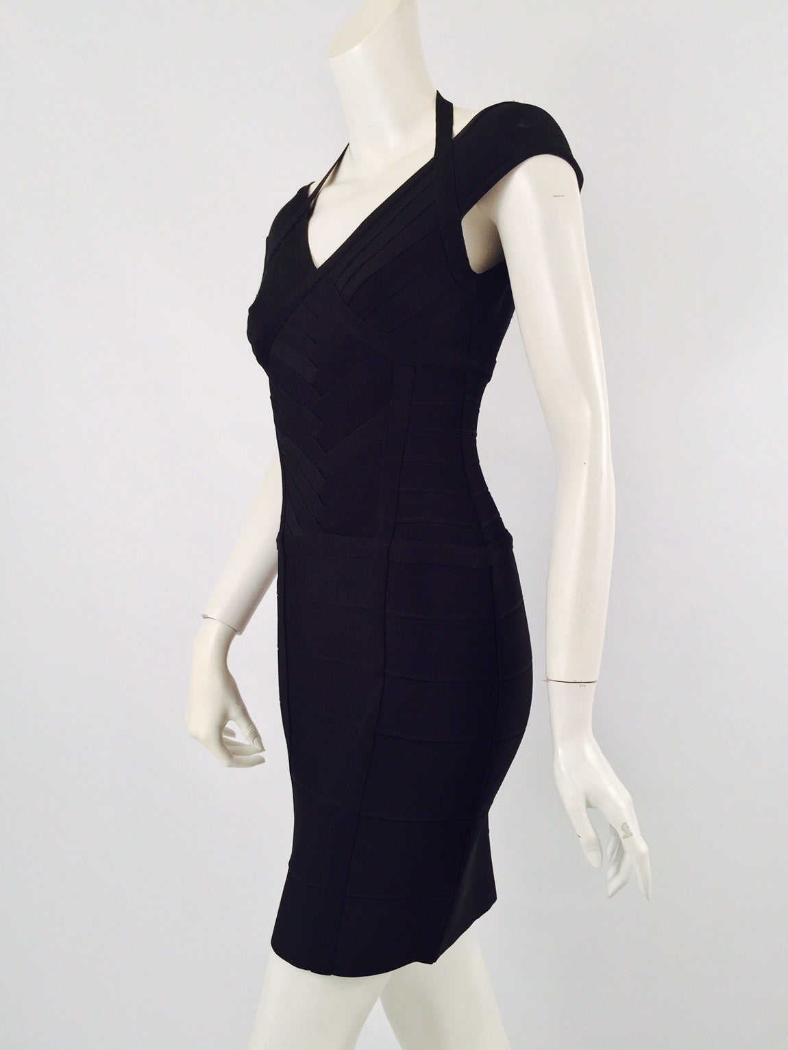 Herve Leger Iconic Black Badage Dress illustrates what made Herve Leger a famous designer in the 1980's. Body conscious? Yes! Unforgettable 